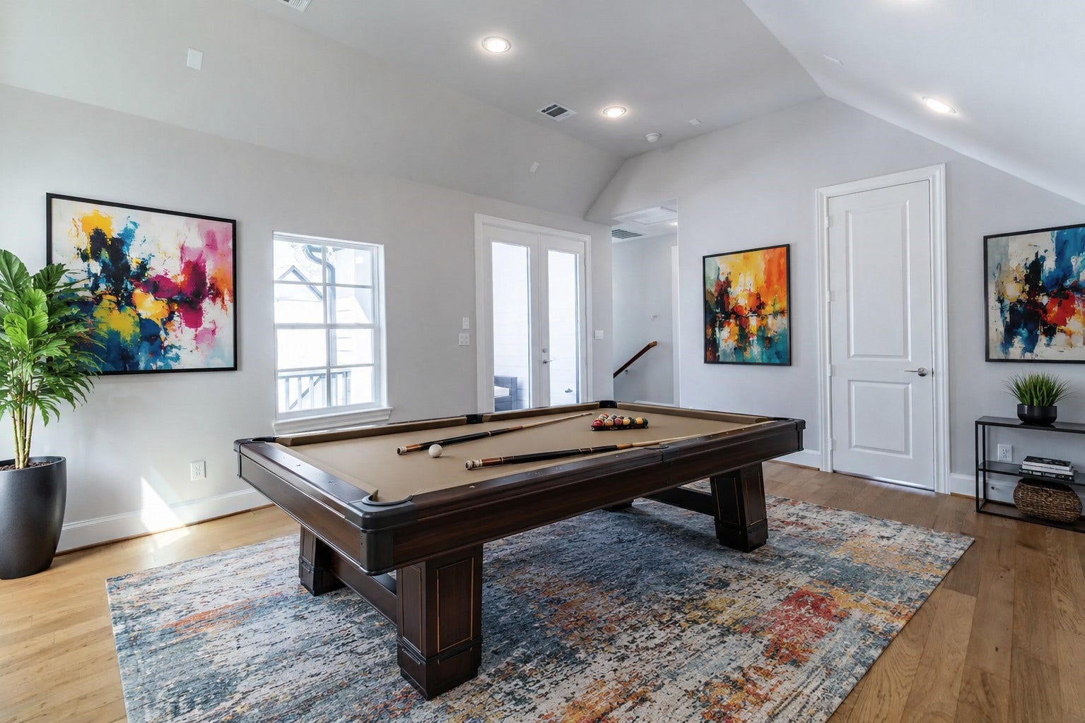 11053 Chatterton Drive, Houston, TX 77043 Bright third-floor game room leads out to the wrap-around rooftop terrace. Virtual staging added.