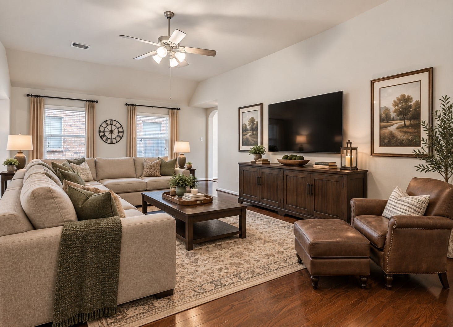 318 Lake Line Drive, Alvin, TX 77511 Another view showcases the generous proportions of the family room, with plenty of space for multiple seating arrangements, wood flooring and a high ceiling creating an airy, comfortable gathering space.