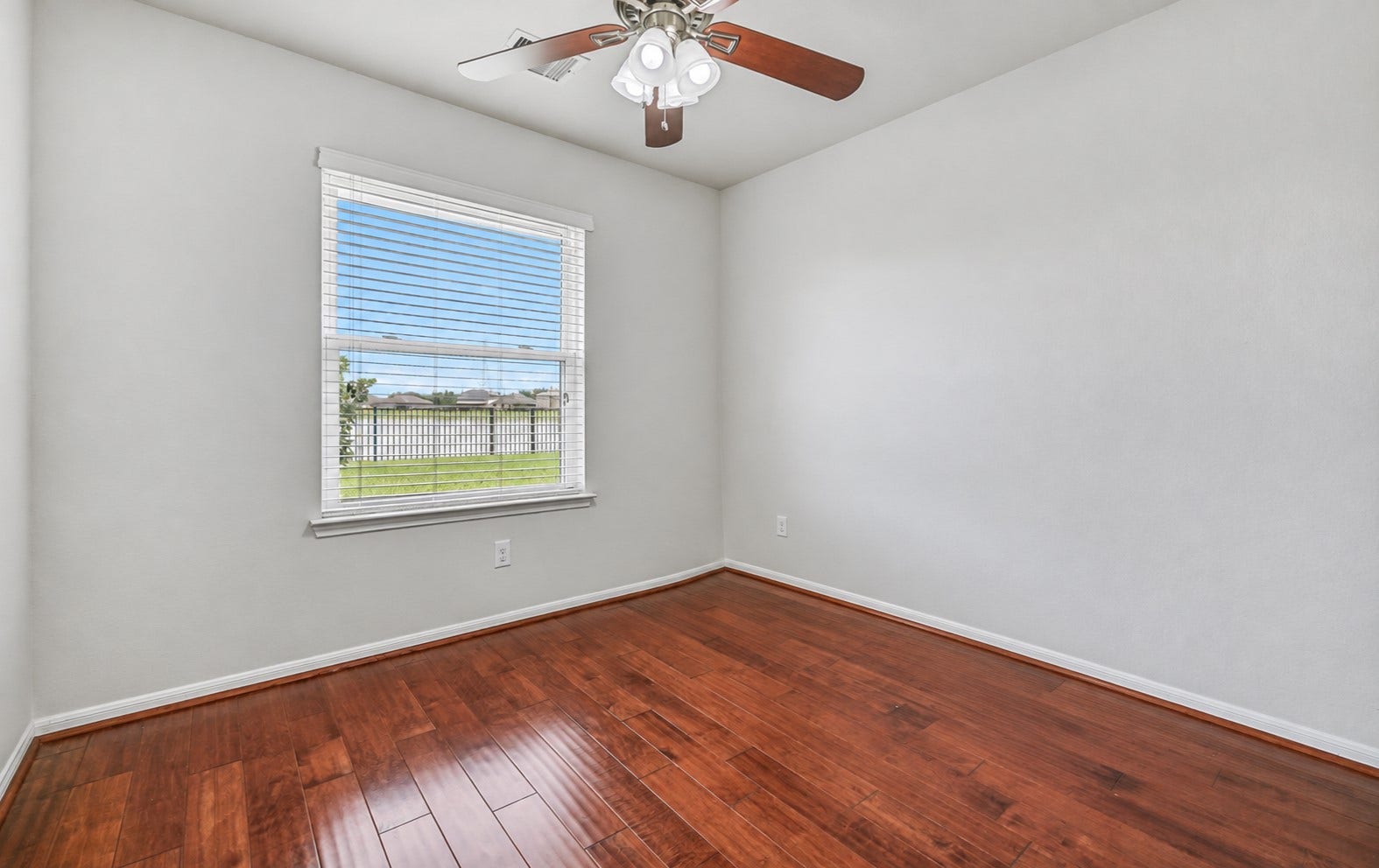 318 Lake Line Drive, Alvin, TX 77511 Tucked privately off the primary suite, this versatile study/flex room features wood flooring, fresh neutral paint, a ceiling fan & large window overlooking the backyard and pondideal for a home office, sitting room, nursery or exercise space.