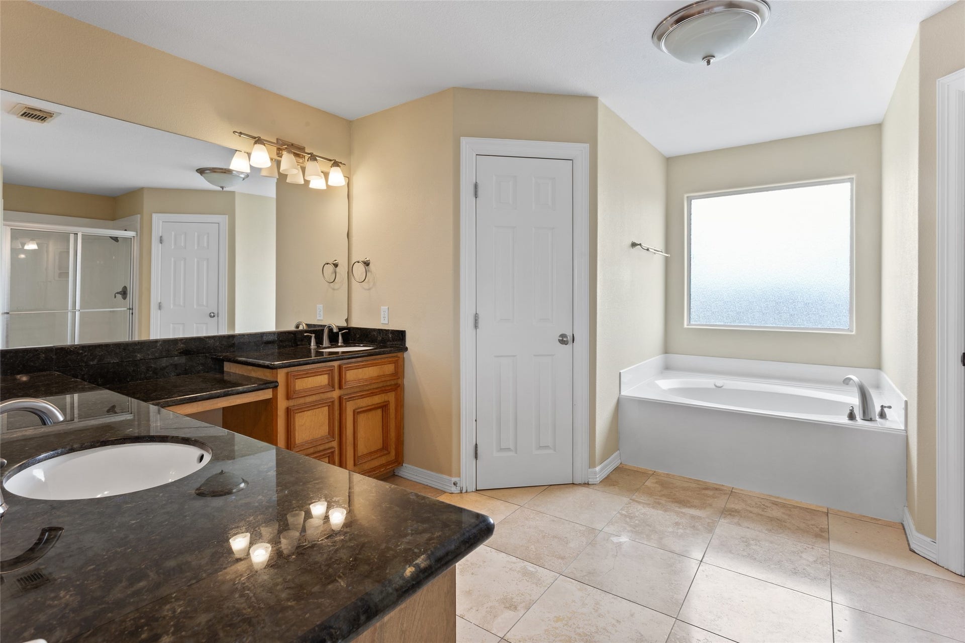 1110 Papeete Street, Tiki Island, TX 77554 Third floor primary bathroom with double vanities and soaking tub