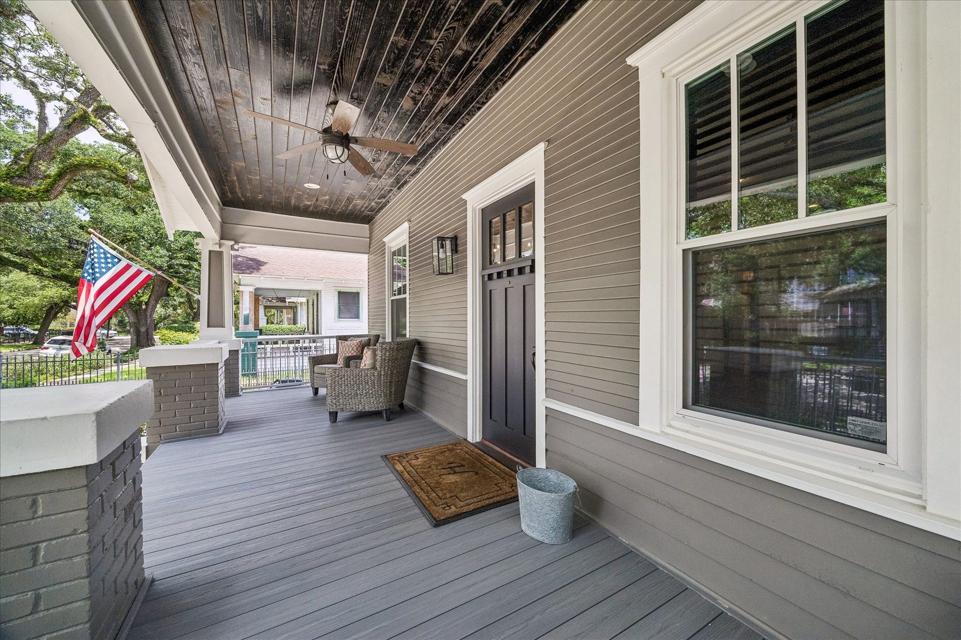 618 Bayland Avenue, Houston, TX 77009 Charming shaded front porch, perfect for a cozy swing.