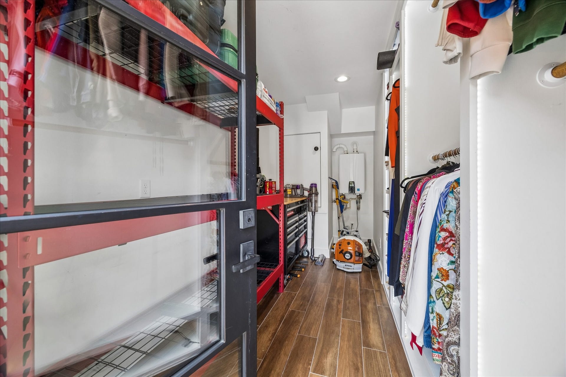 618 Bayland Avenue, Houston, TX 77009 Spacious storage room with organized shelving and ample hanging space.