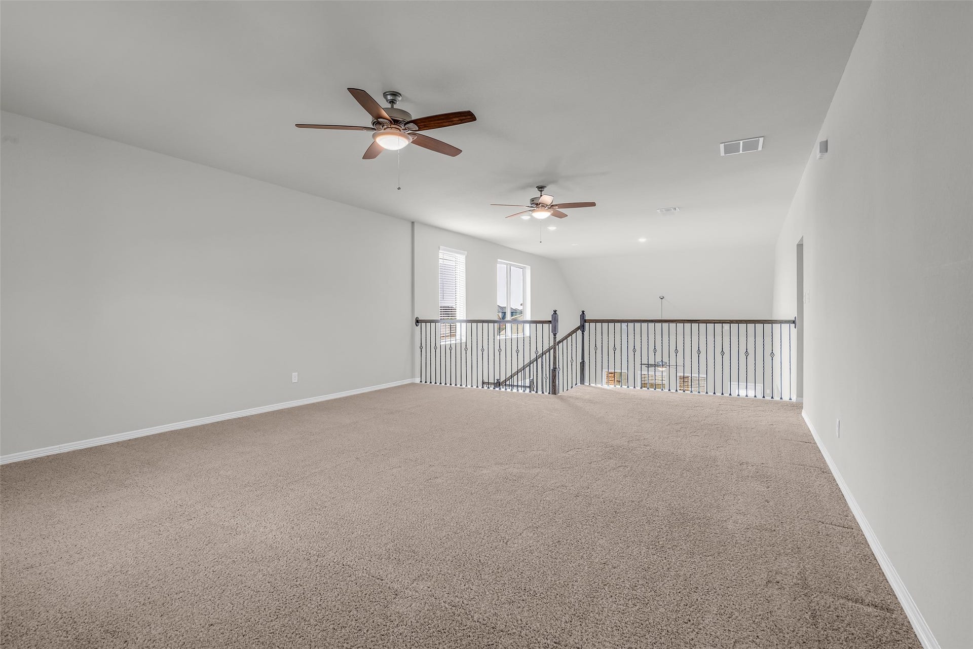 801 Bahia Bay Drive, Katy, TX 77493 This spacious upstairs game room offers incredible versatility, featuring ample space for a pool table, a dedicated study area, a gaming zone, a cozy reading nook.