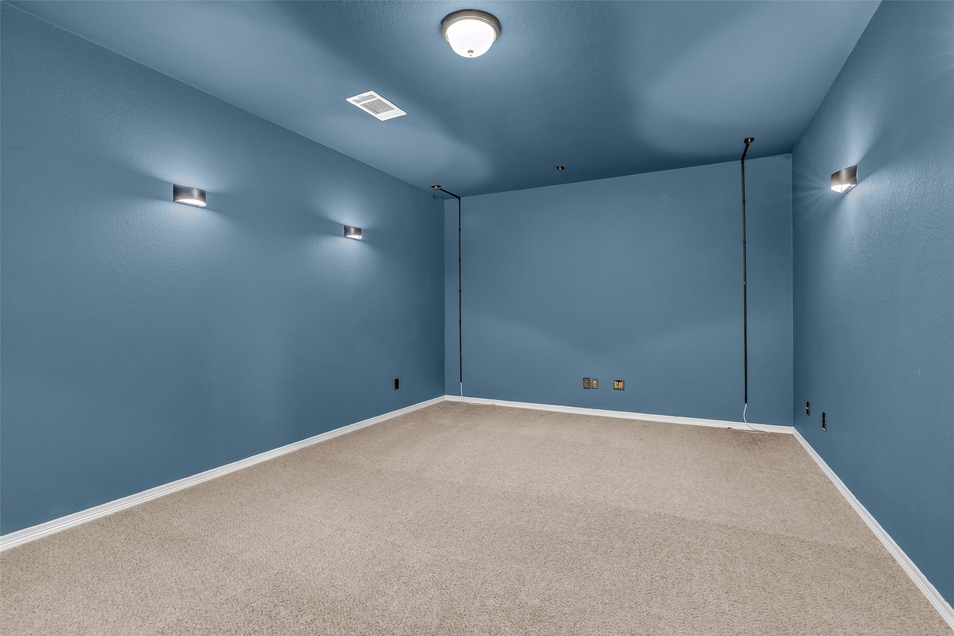 801 Bahia Bay Drive, Katy, TX 77493 This dedicated media room is the perfect space for family gatherings and movie nights, offering a comfortable and immersive environment for entertainment.