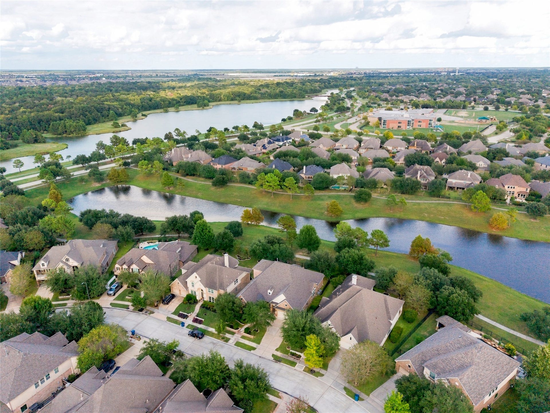 19215 Shady Blossom Drive, Cypress, TX 77433 Aerial view of this remarkable home with waterfront surroundings!