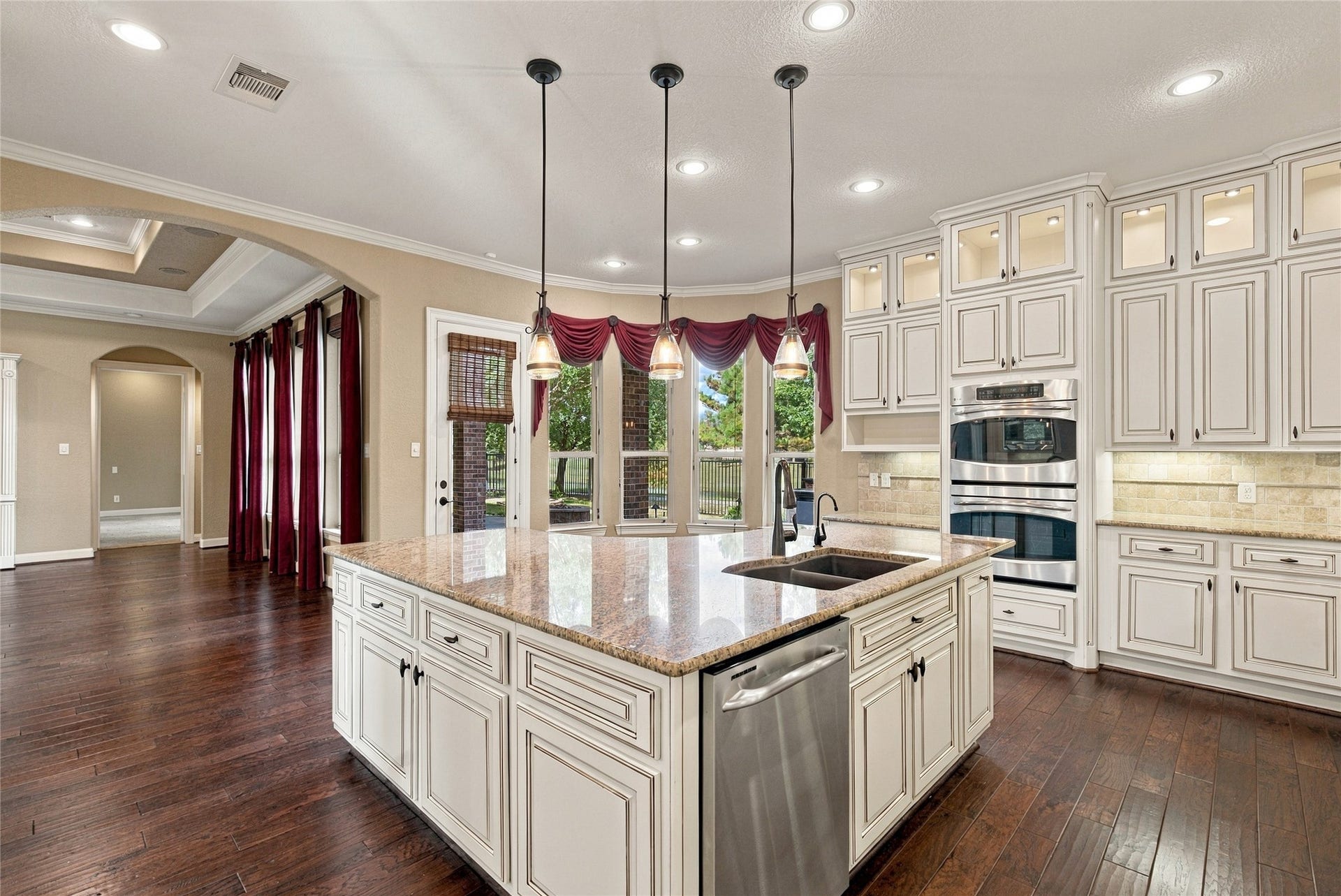 19215 Shady Blossom Drive, Cypress, TX 77433 Another view of the impressive kitchen showcasing the spacious center island, pendant lighting, double ovens, and abundant cabinet storage.