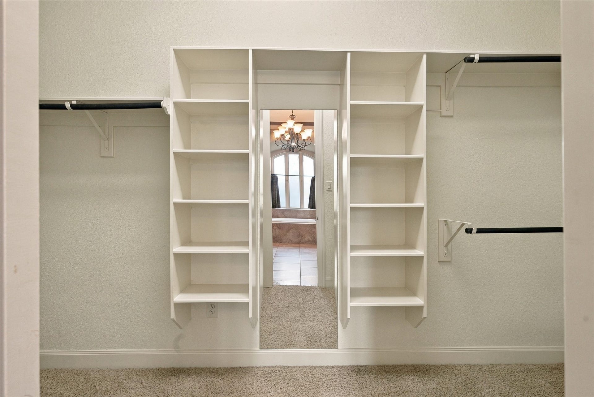 19215 Shady Blossom Drive, Cypress, TX 77433 Generous primary walk-in closet featuring built-in shelving and plenty of space for organizing your wardrobe.