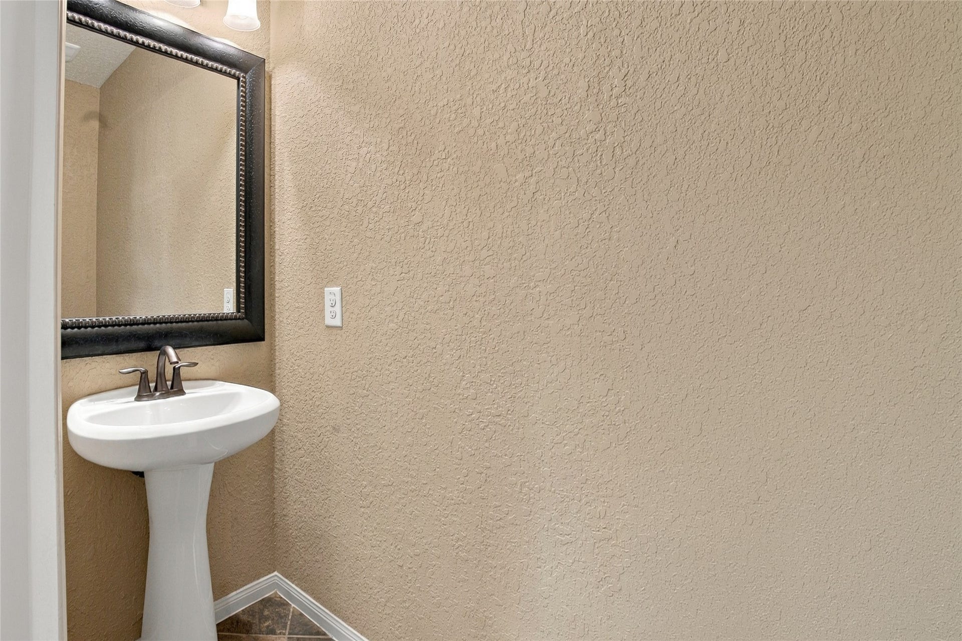 19215 Shady Blossom Drive, Cypress, TX 77433 Convenient half bathroom located upstairs, providing added functionality for the bonus room.