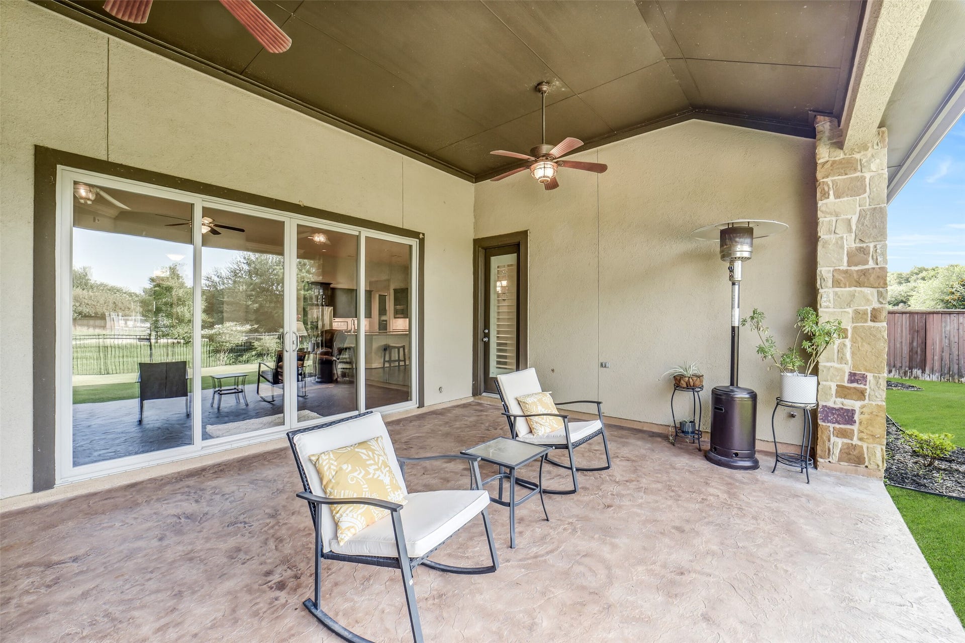 2721 Saddlehorn Trail, Katy, TX 77494 Step outside to this expansive back patio. Notice the single side door, it leads to a convenient half bath.