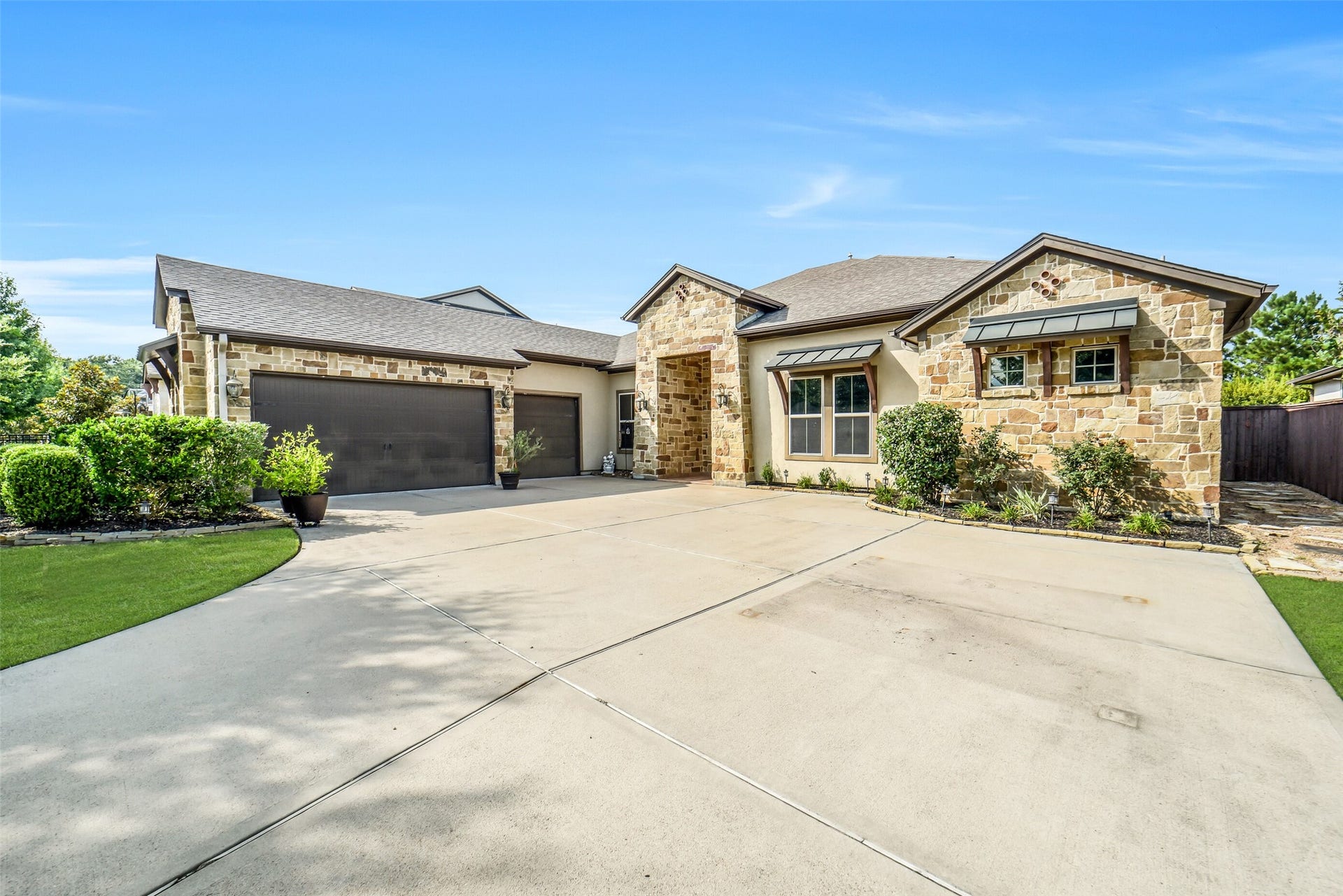 2721 Saddlehorn Trail, Katy, TX 77494 Beautiful stone and stucco elevation with a 3-car garage, manicured landscaping, and an inviting covered front porch offer exceptional curb appeal.