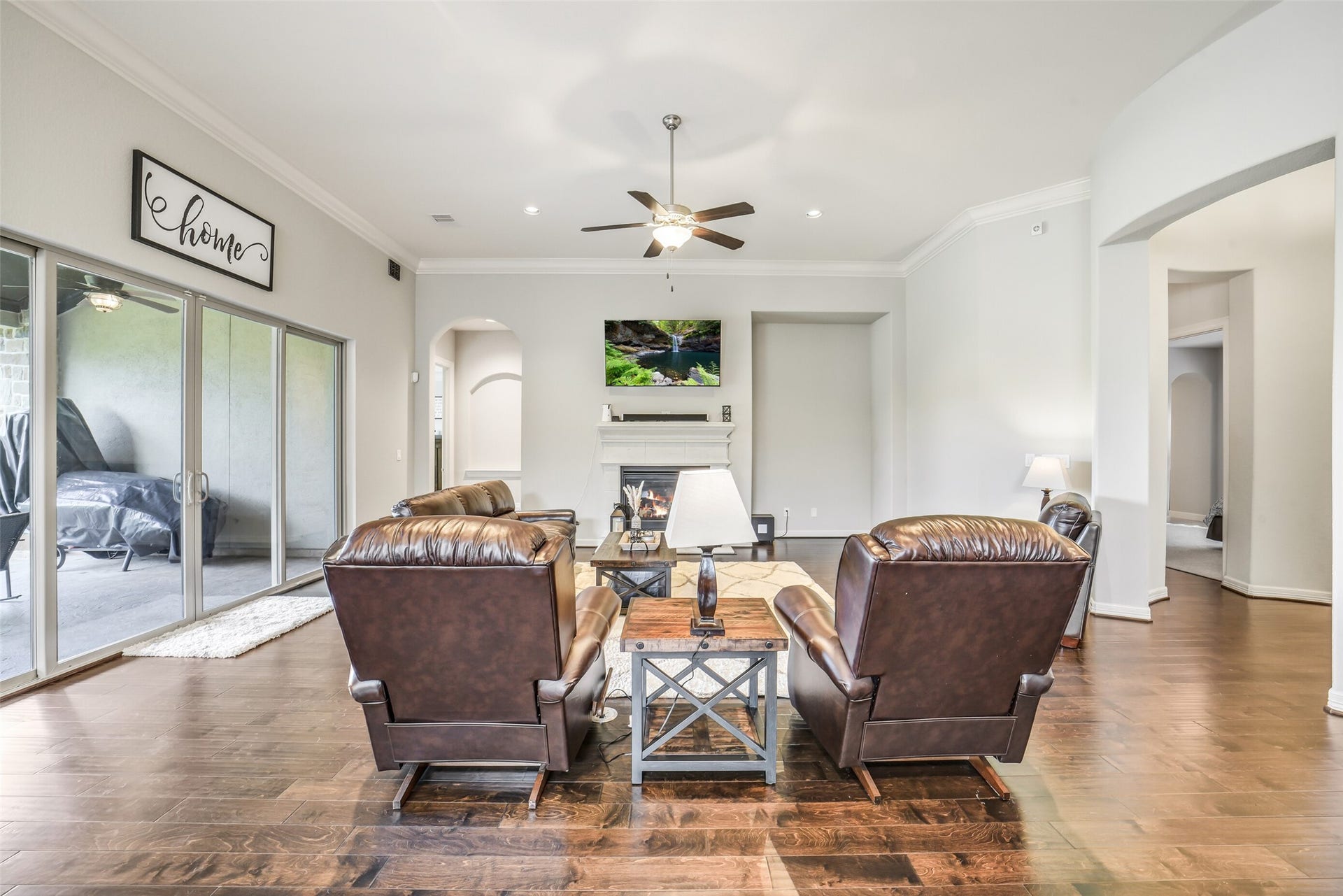 2721 Saddlehorn Trail, Katy, TX 77494 As you walk into the living area you notice the openness and light shining through the sliding doors.