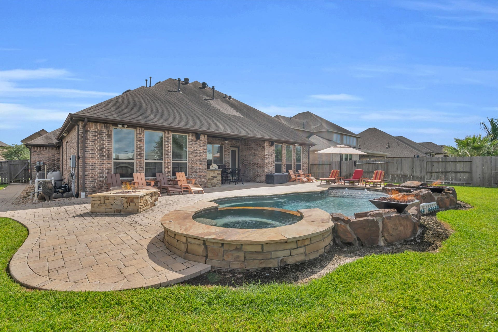 Full view of this backyard oasis with tons of space to entertain.