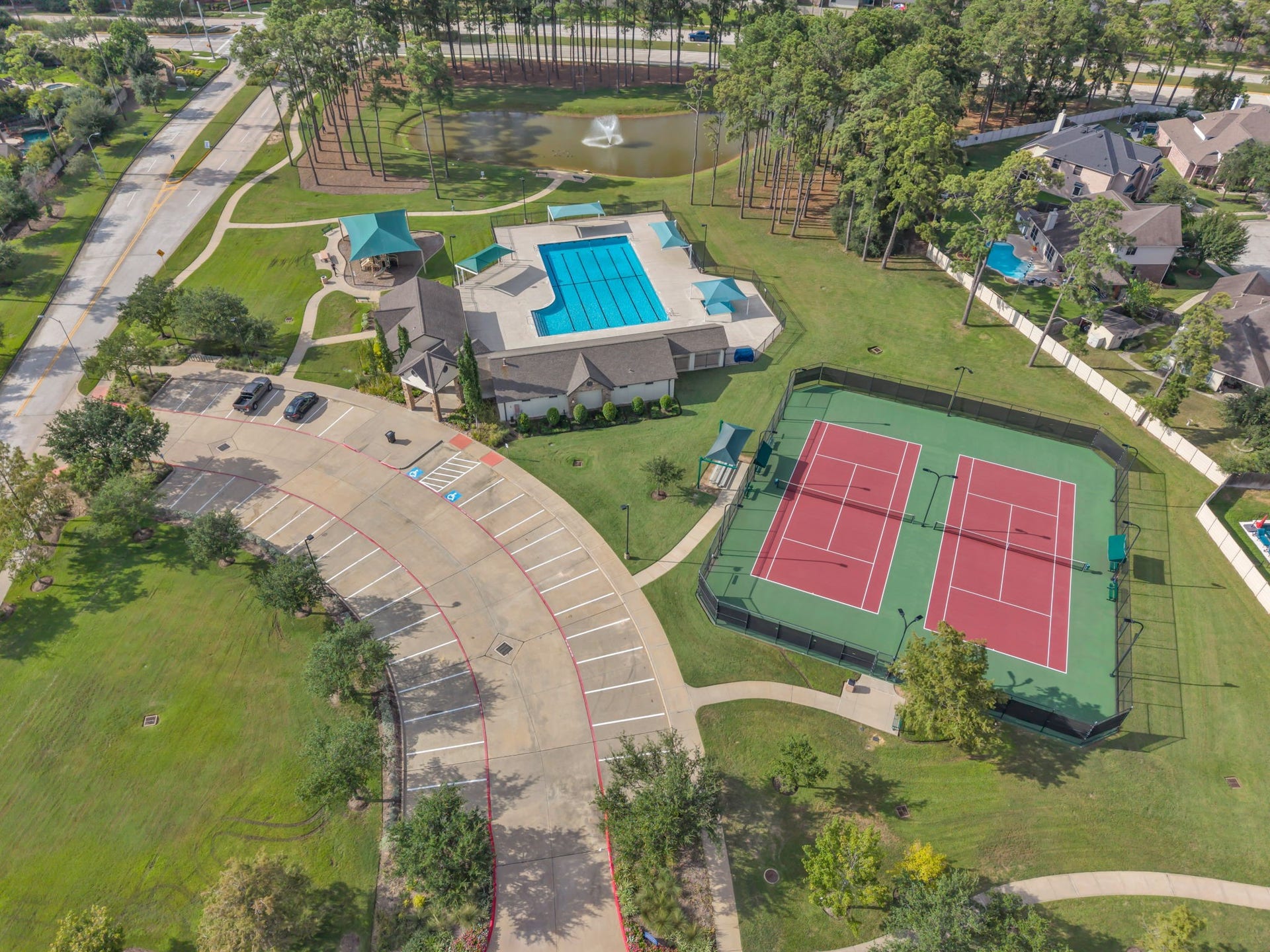 Amazing community amenities offer a large pool, tennis courts, shaded gathering areas, and green space.
