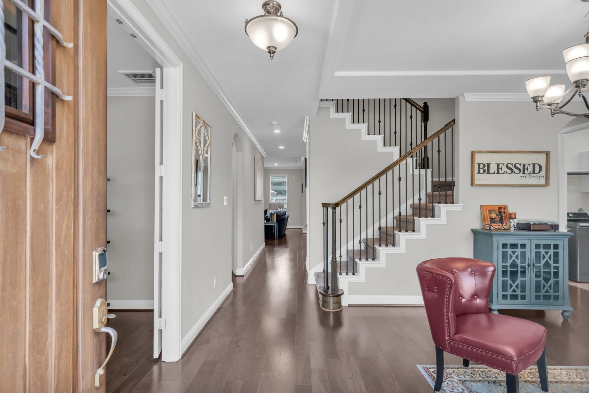 Inviting entry opens to a dramatic staircase and flows into the main living areas.