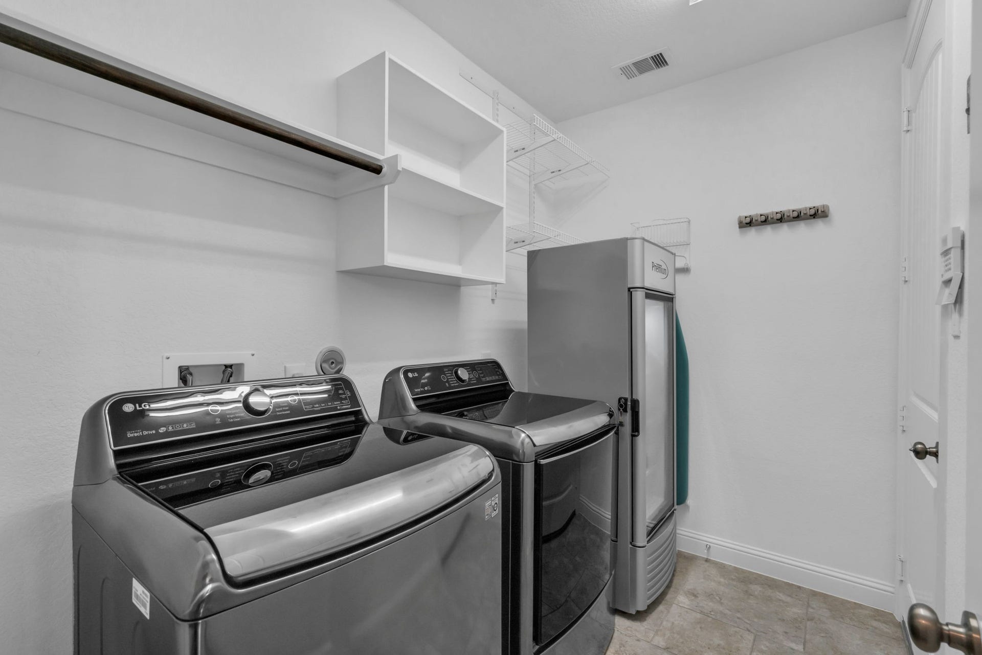 Laundry room off the kitchen with access to the garage.