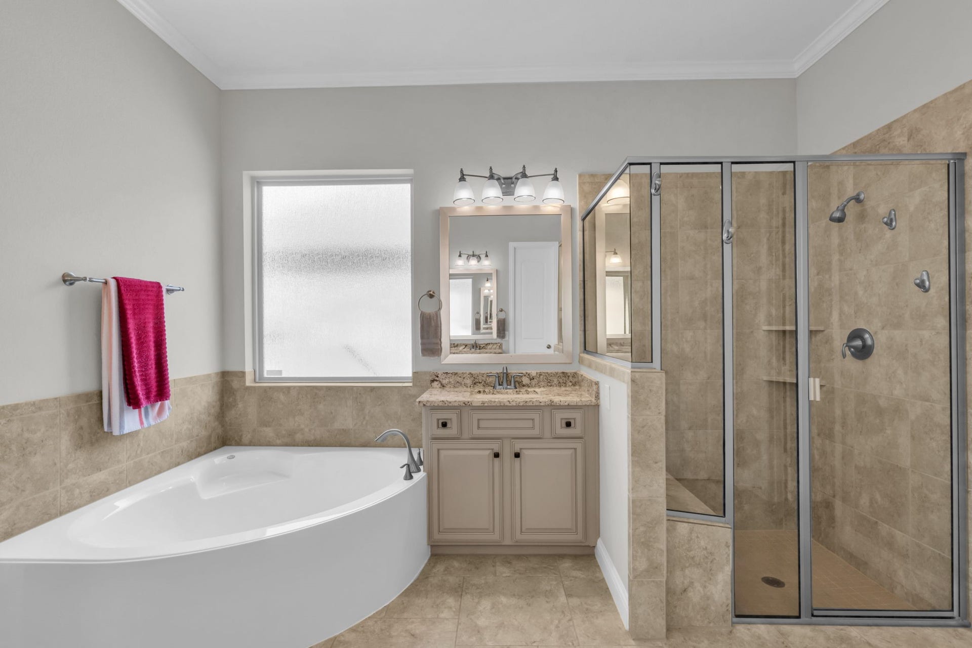 Relaxing soaking tub framed by a picture window, perfect for unwinding.