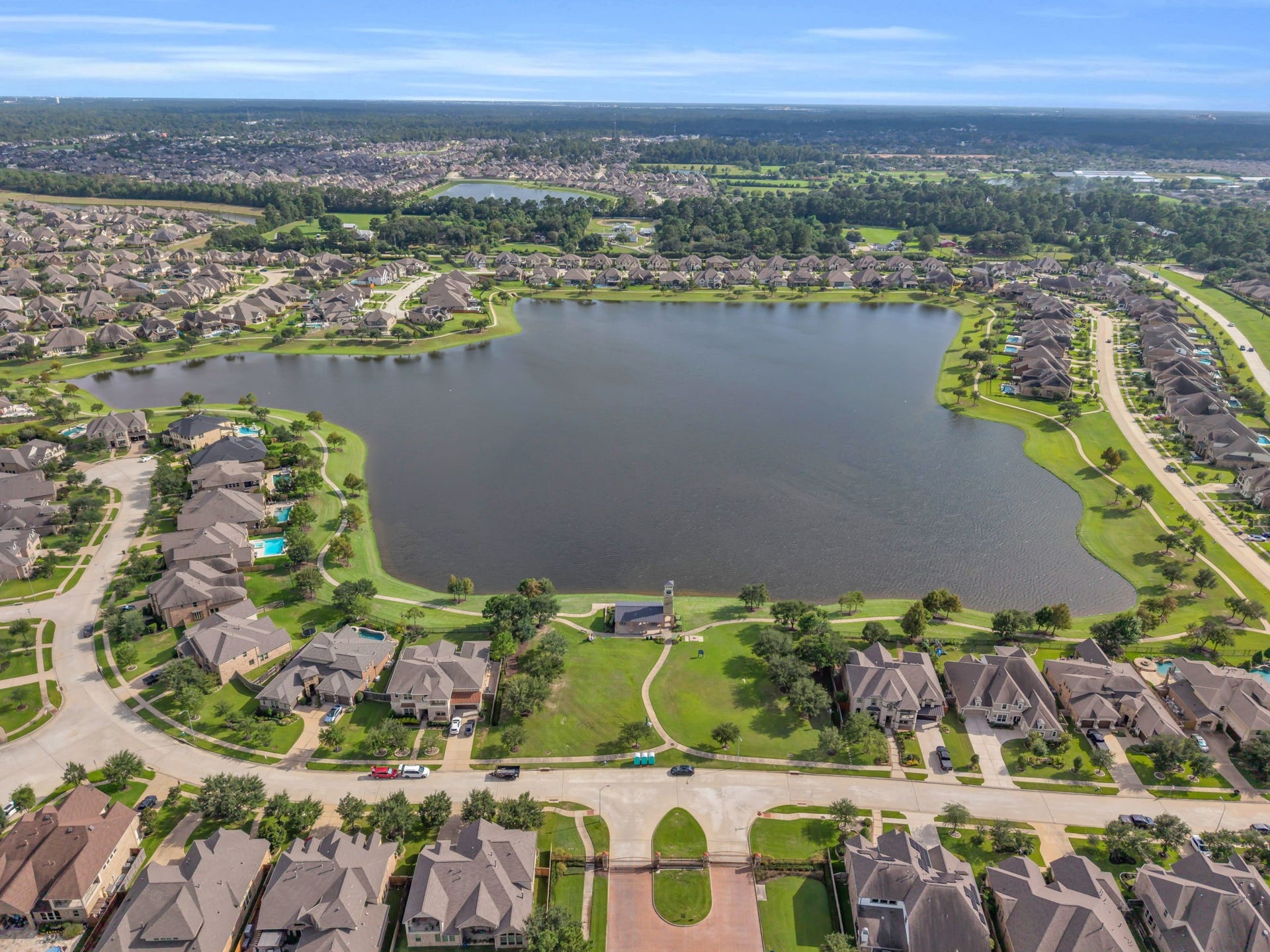Expansive look at the community pond with walking trails.
