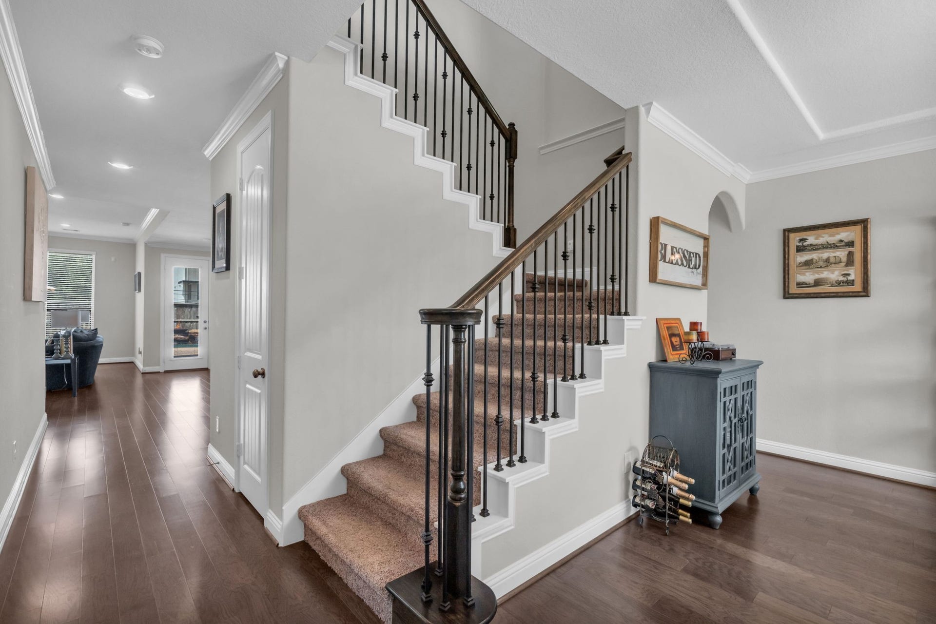 Elegant staircase with an additional huge under-the-stairs storage closet.