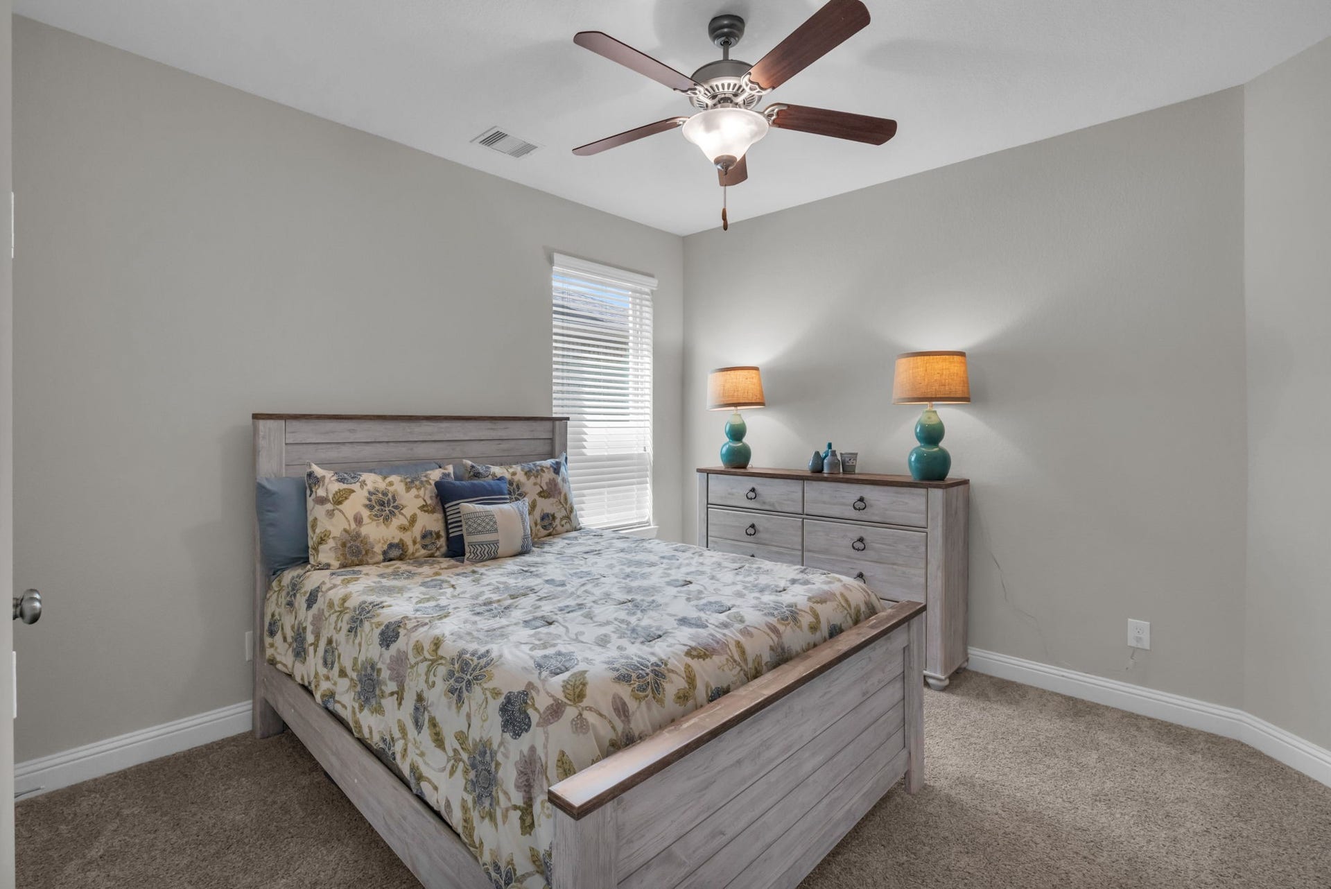 Downstairs secondary bedroom with a walk-in closet.