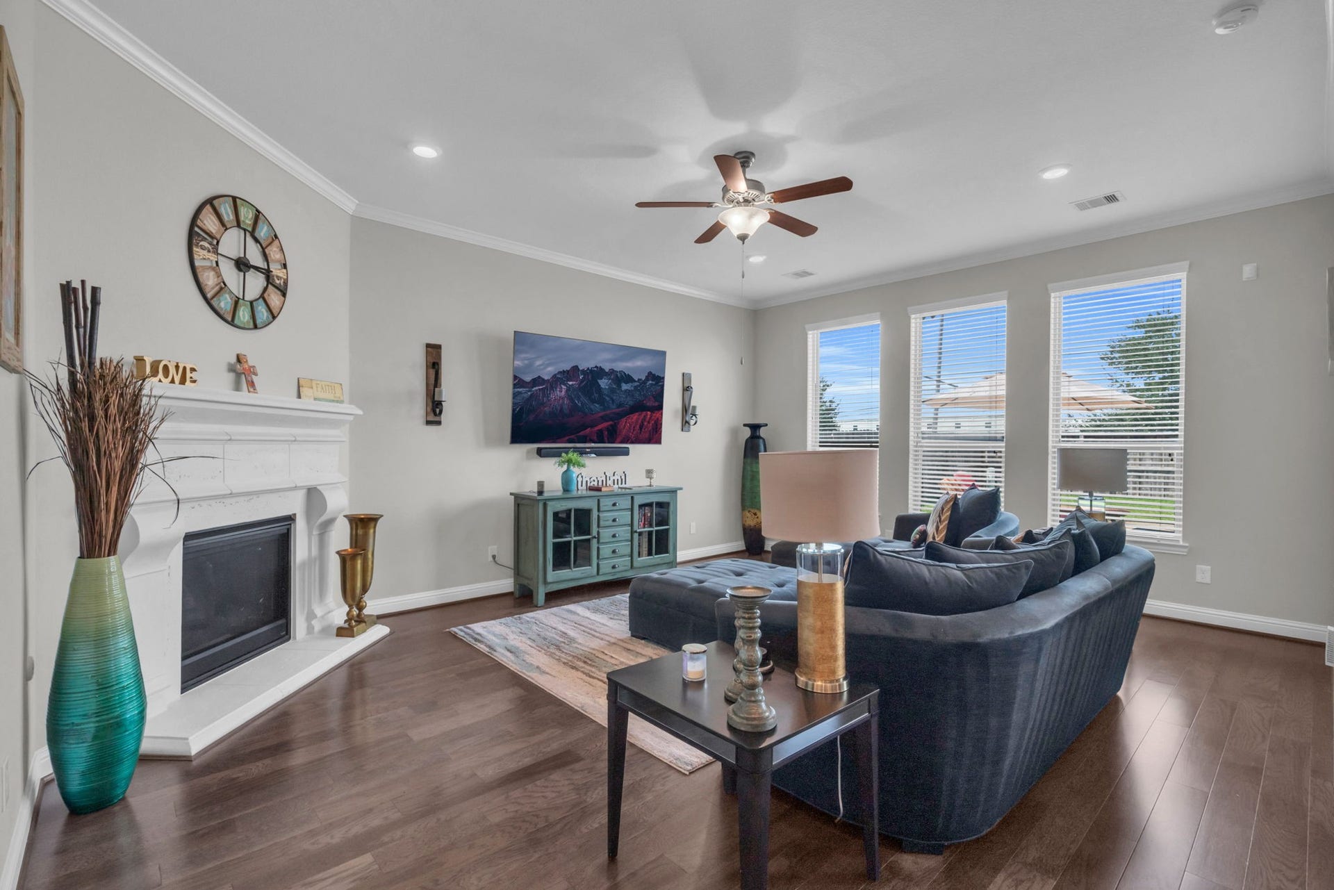 Impressive living room features a cozy fireplace and plenty of space to entertain.