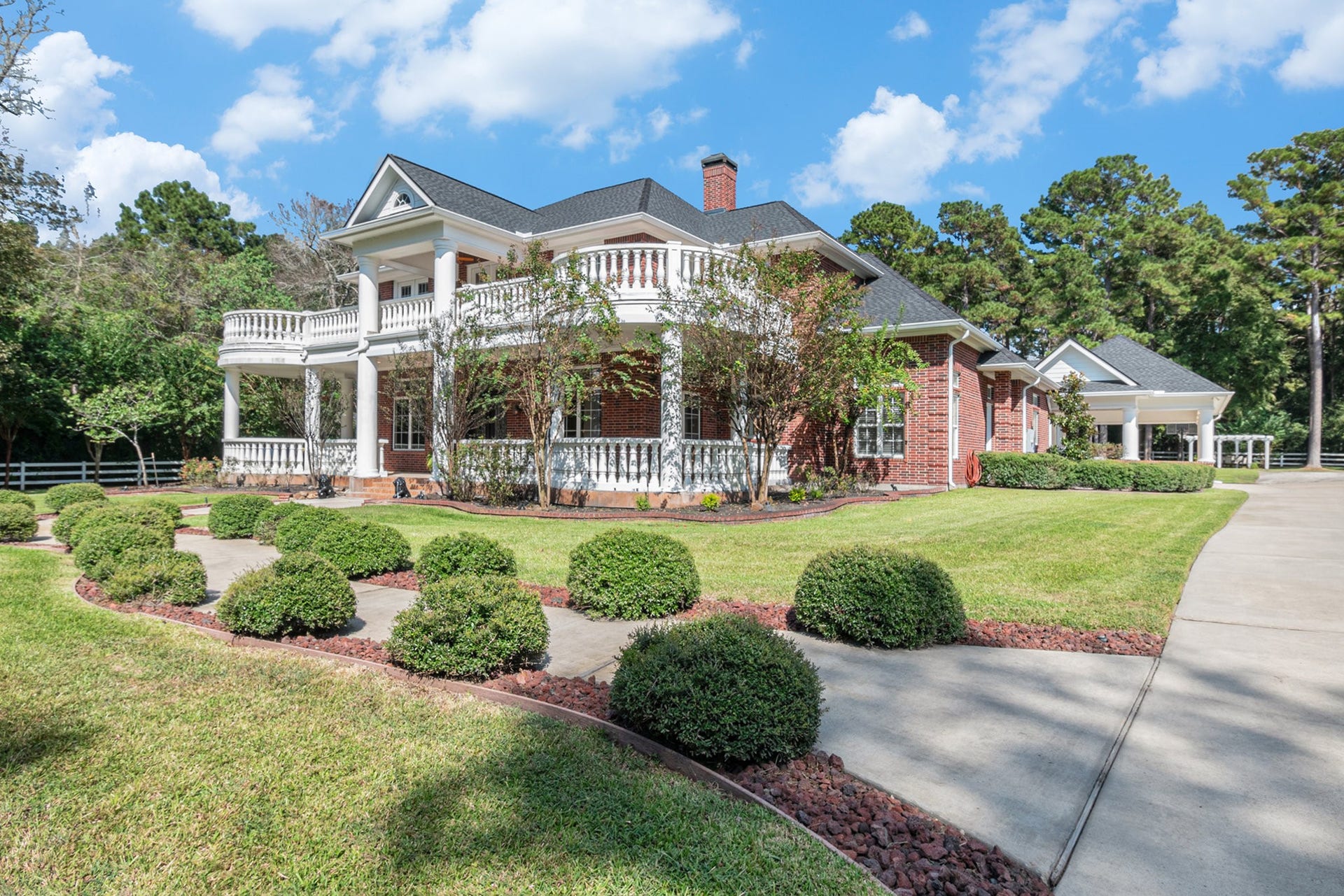 28126 Indigo Lake Court, Magnolia, TX 77355 Stunning landscaping and tons of beautiful trees surround this fabulous property.
