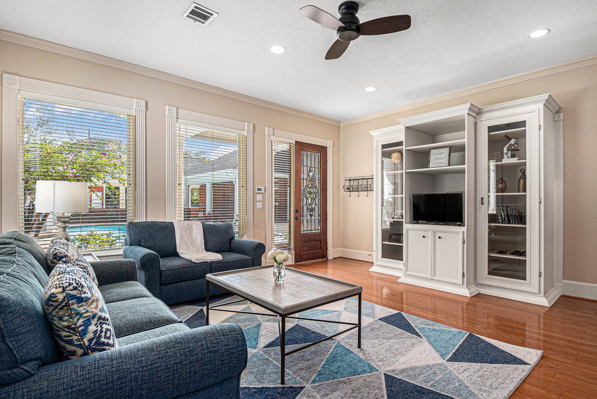 28126 Indigo Lake Court, Magnolia, TX 77355 Beautiful living room in the guest house with stunning views of the backyard.