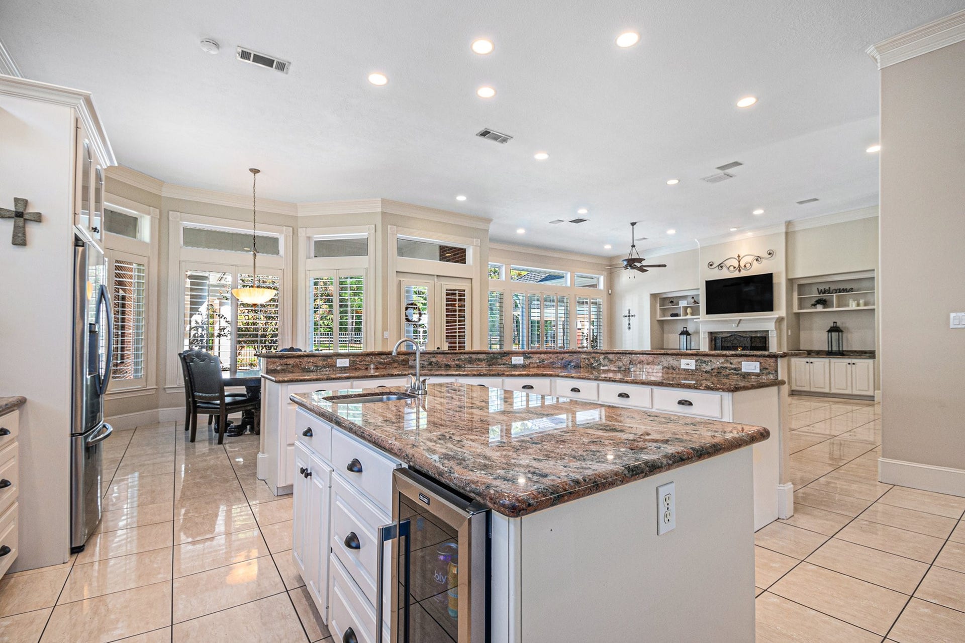 28126 Indigo Lake Court, Magnolia, TX 77355 Other amenities to this astonishing kitchen is the built in mini fridge, a big walk-in pantry, and a breakfast nook.