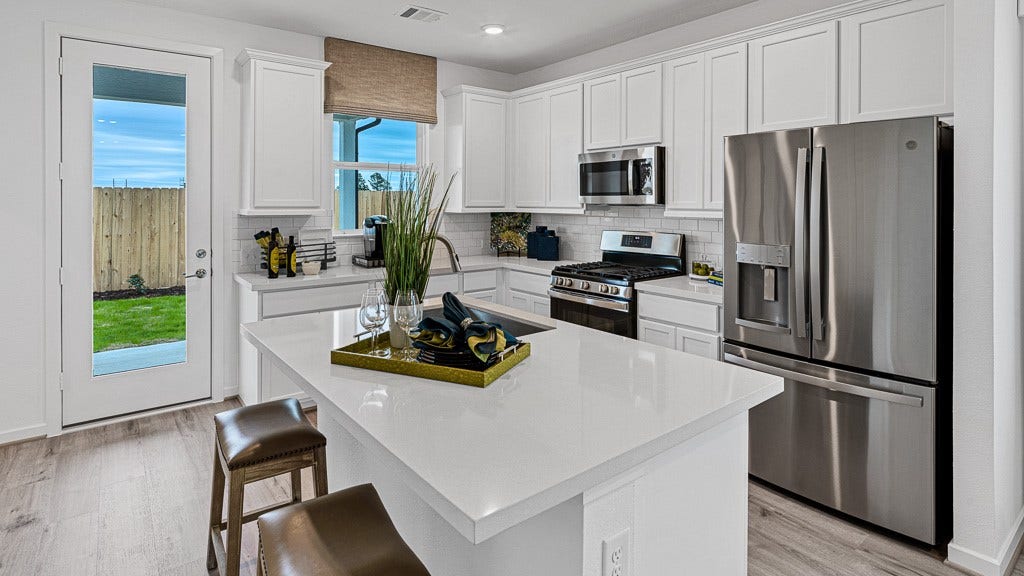 7334 Grand Mason Drive, Cypress, TX 77433 Glass door has views and access to backyard.