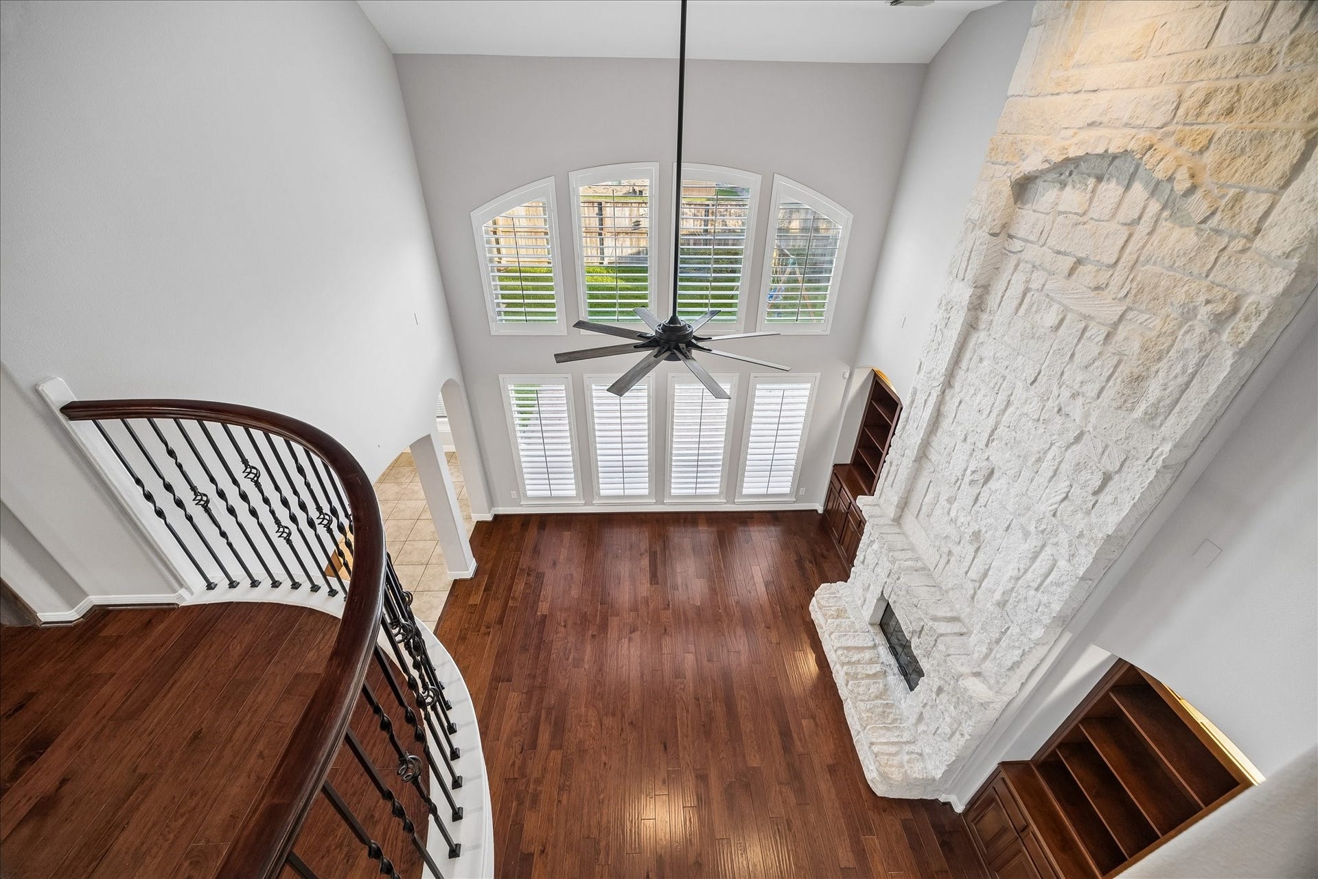 2902 Grand Mesa Pass, Missouri City, TX 77459 The Juliette balcony adds a romantic touch to the 2nd floor landing and a little extra drama to the family room below. Rich wood railings and iron balusters tie it all together beautifully.