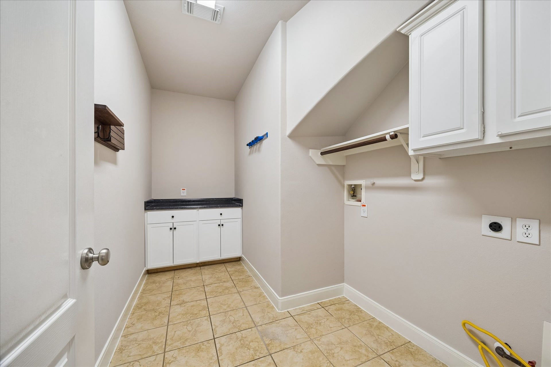 2902 Grand Mesa Pass, Missouri City, TX 77459 Even laundry day gets a little easier with a dedicated utility room offering built-in storage, hanging space and a folding counter to help keep everything organized.