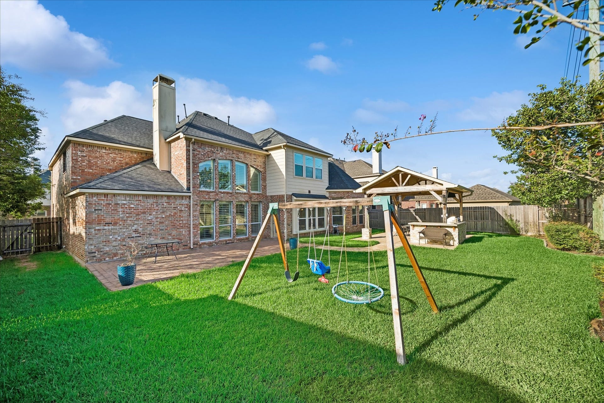 2902 Grand Mesa Pass, Missouri City, TX 77459 There is plenty of room to enjoy the outdoors here, from the extensive patio and covered summer kitchen to the sprawling fenced yard. A full sprinkler system helps keep the lawn looking good while you spend more time relaxing, entertaining and enjoying the space.