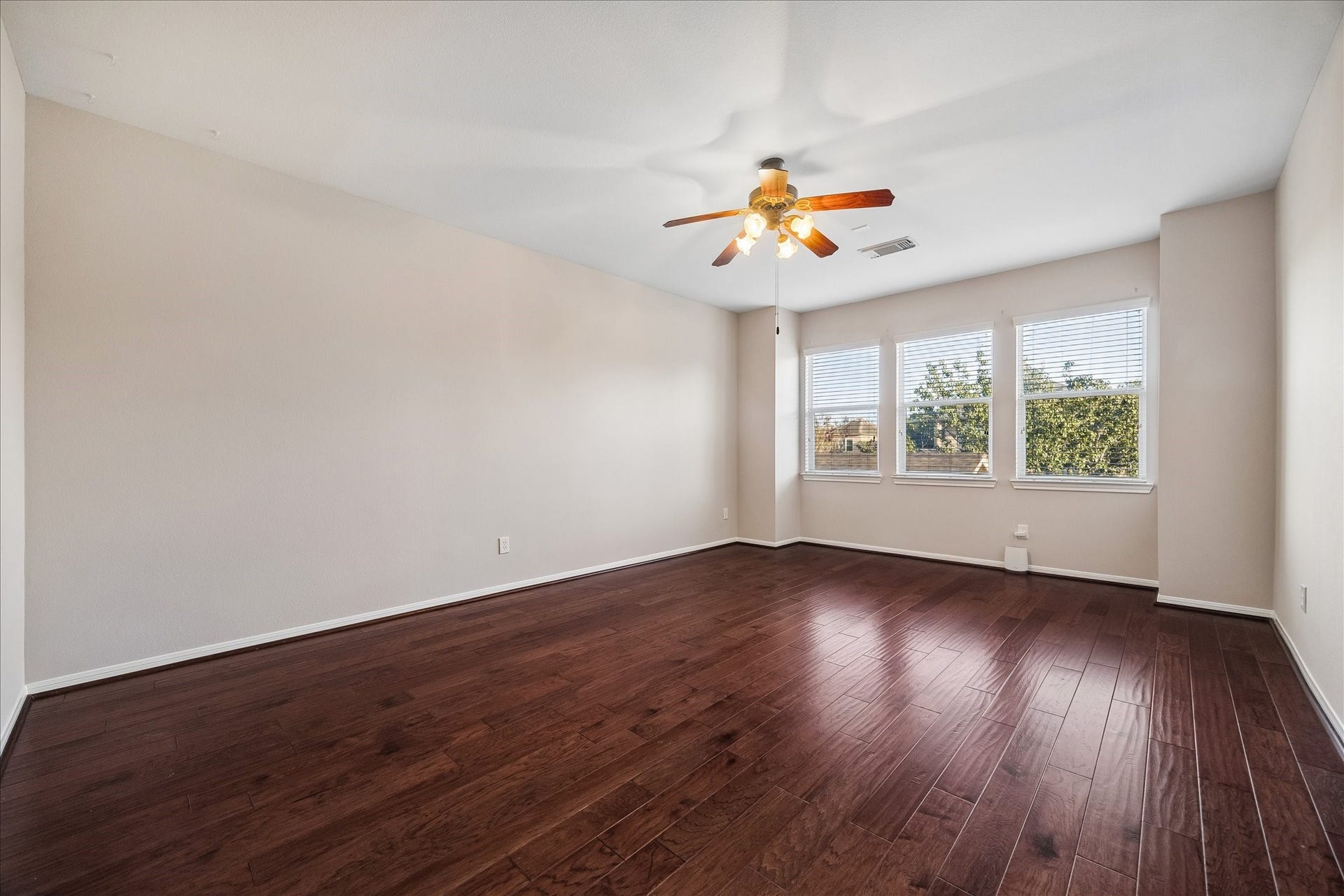 2902 Grand Mesa Pass, Missouri City, TX 77459 Room to play, lounge or create your own favorite hangout. Fresh paint, resurfaced wood flooring and oversized windows keep the game room bright and inviting, with plenty of space to make it your own.
