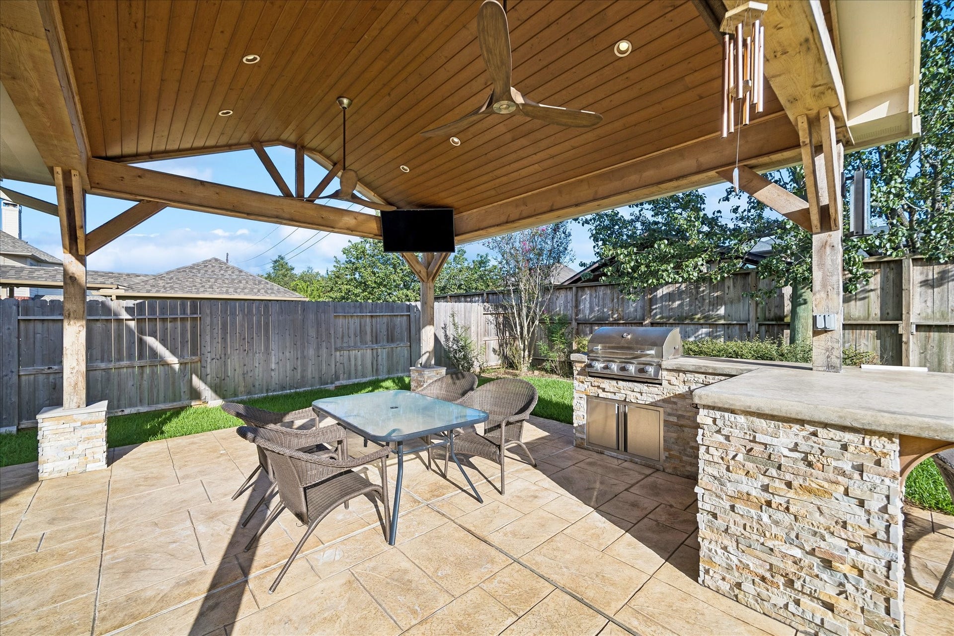 2902 Grand Mesa Pass, Missouri City, TX 77459 Summer BBQs, game days and easy evenings at home are all better out here. The covered outdoor kitchen brings the fun with stainless steel appliances, stone counters and tile flooring, while the cathedral ceiling, twin fans and recessed lighting keep the space comfortable and ready for a crowd.