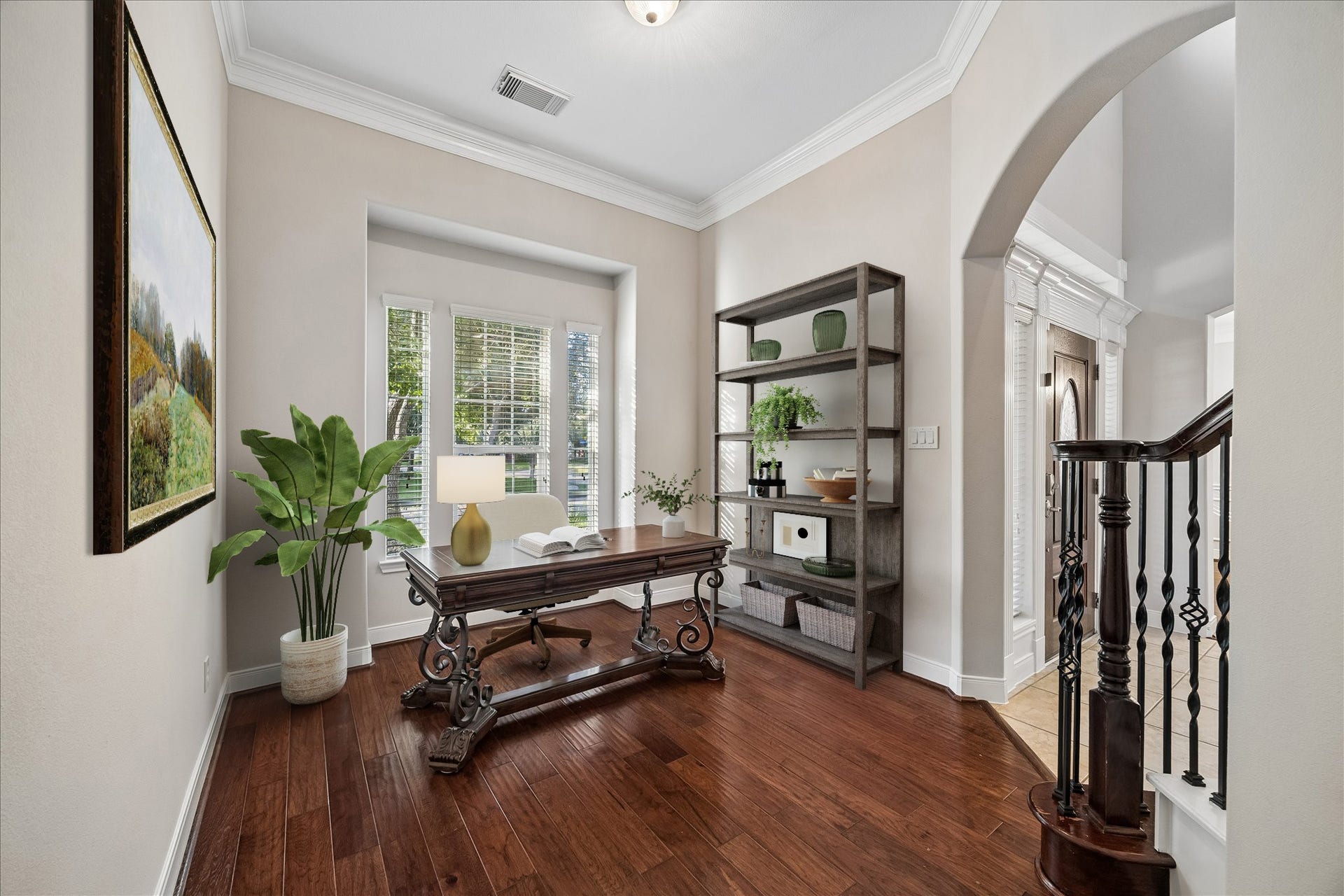 2902 Grand Mesa Pass, Missouri City, TX 77459 This quiet nook makes the perfect study for the at home pro, with rich wood flooring, fresh paint, crown molding and a large window that brings in natural light and front yard views.