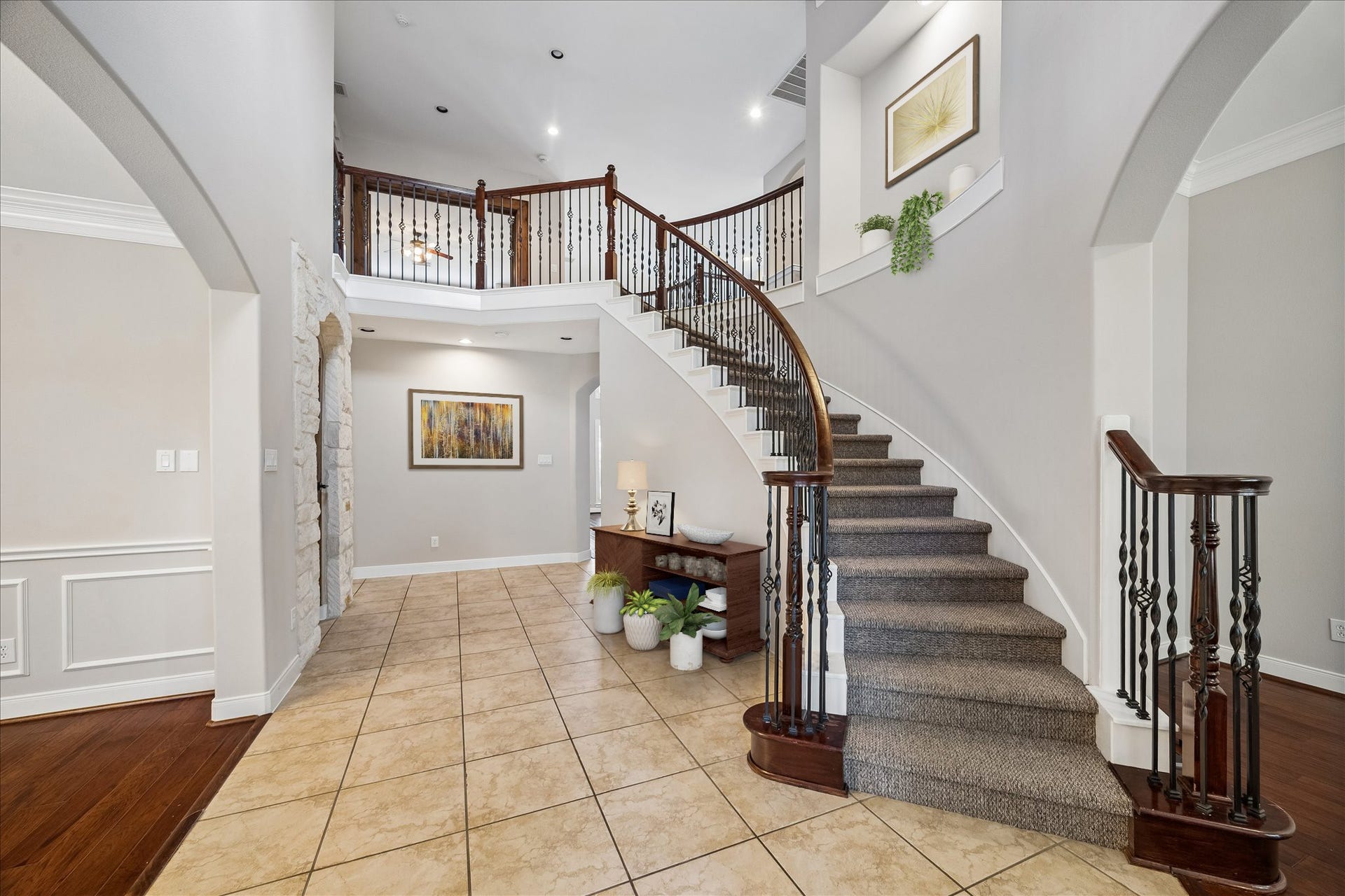 2902 Grand Mesa Pass, Missouri City, TX 77459 This entry knows how to make a first impression. The soaring 2 story ceiling and sweeping staircase bring the drama, while the layout keeps things functional with a private study on one side, formal dining and the wine grotto on the other, and the family room straight ahead.