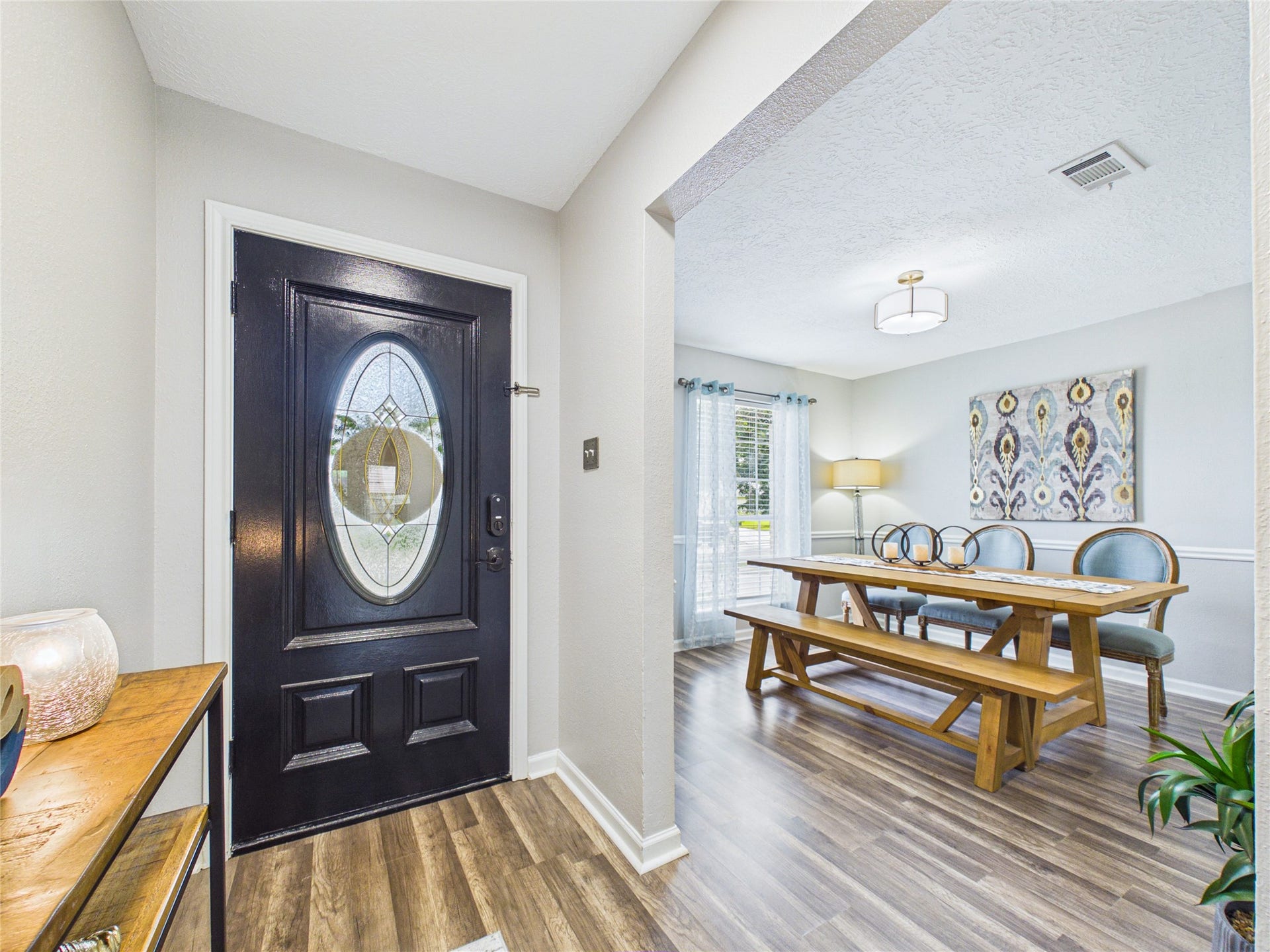 6209 Brookdale Drive, League City, TX 77573 Inviting entryway with a stylish black door and near dining area.