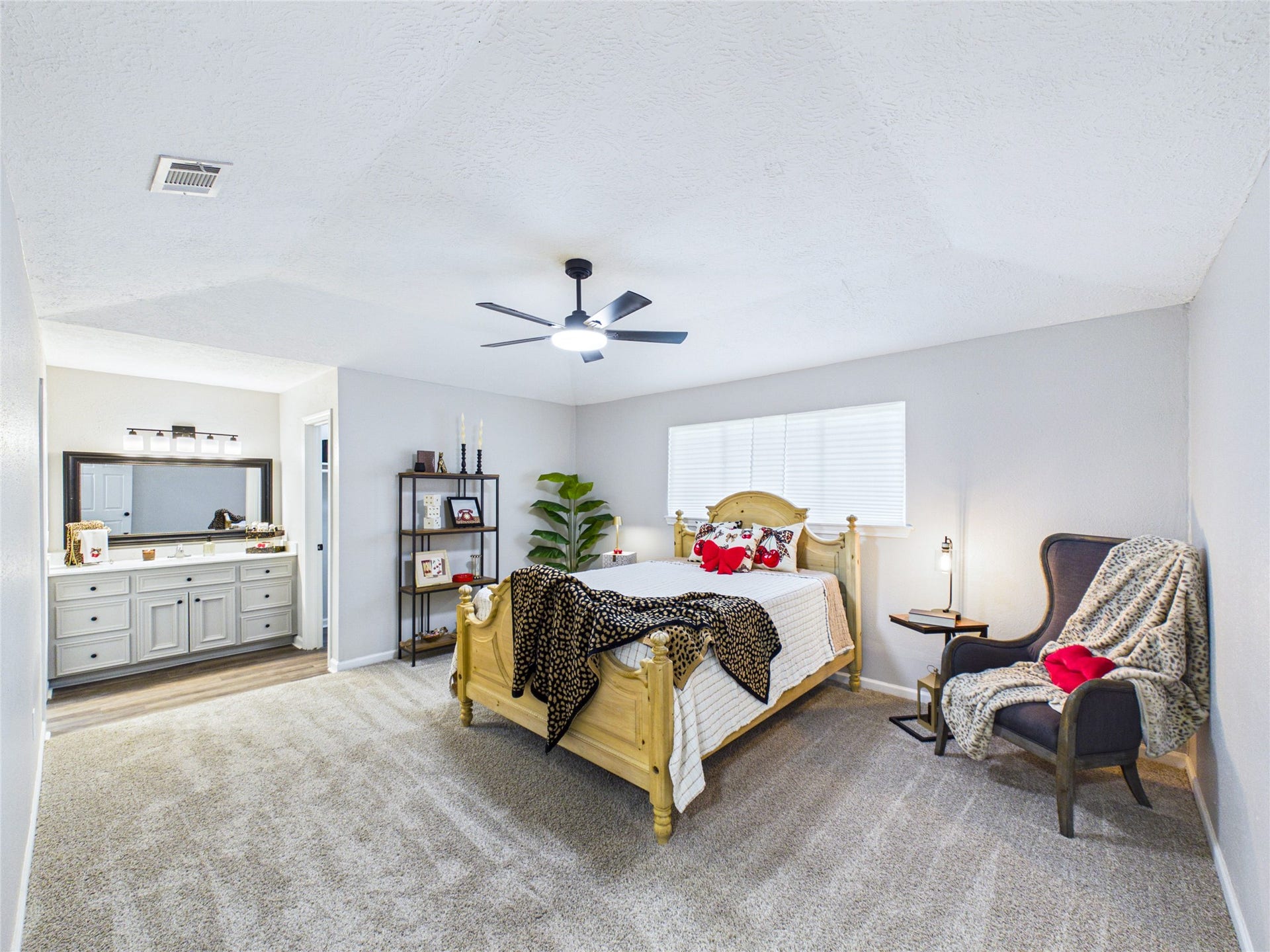 6209 Brookdale Drive, League City, TX 77573 Spacious Primary bedroom featuring new carpeting, and an en-suite bathroom with a vanity.