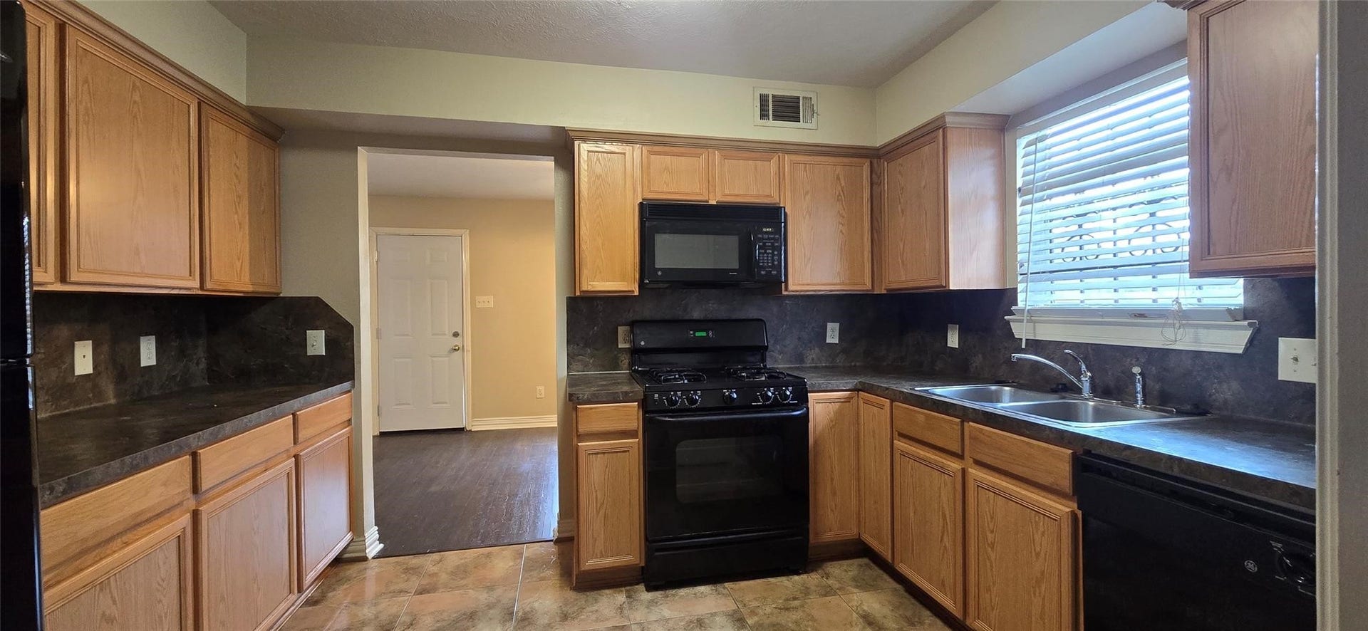 7929 Comal Street, Houston, TX 77051 Garage access is through the kitchen.