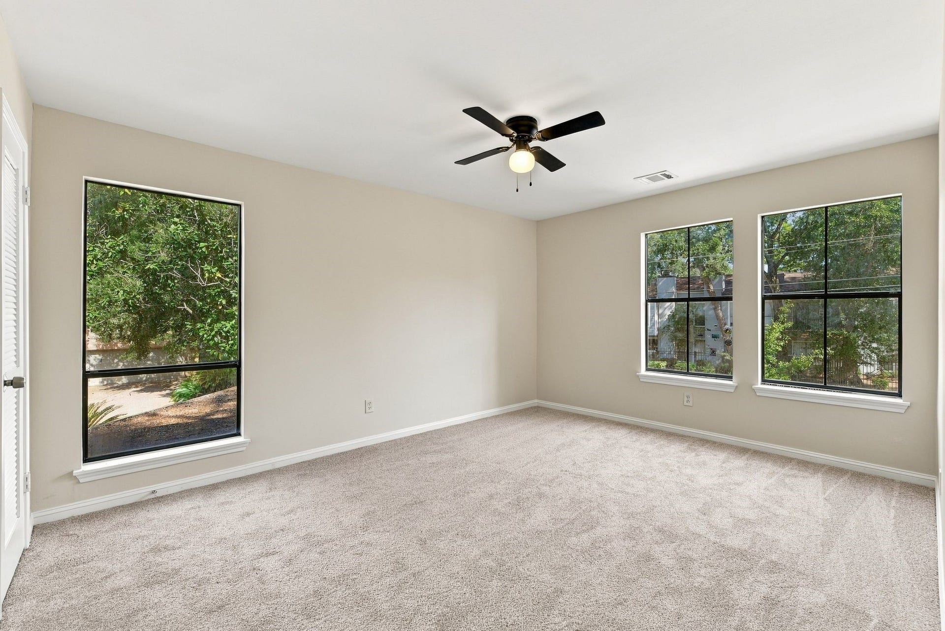 Additional bedroom perspective highlighting the windows, natural light, and flexible furniture arrangement.