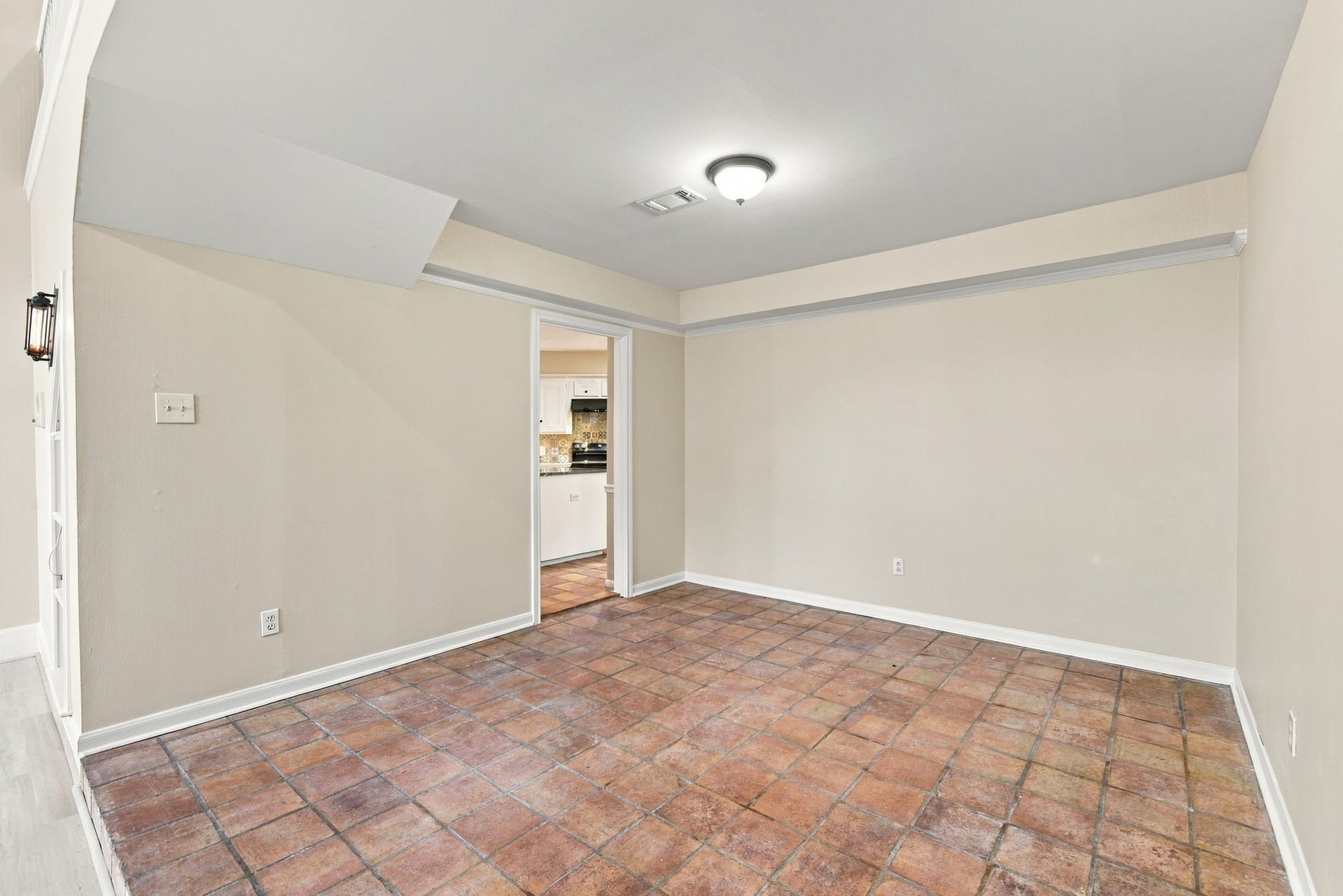 Additional perspective of the formal dining room highlighting its flexible layout and proximity to the kitchen.