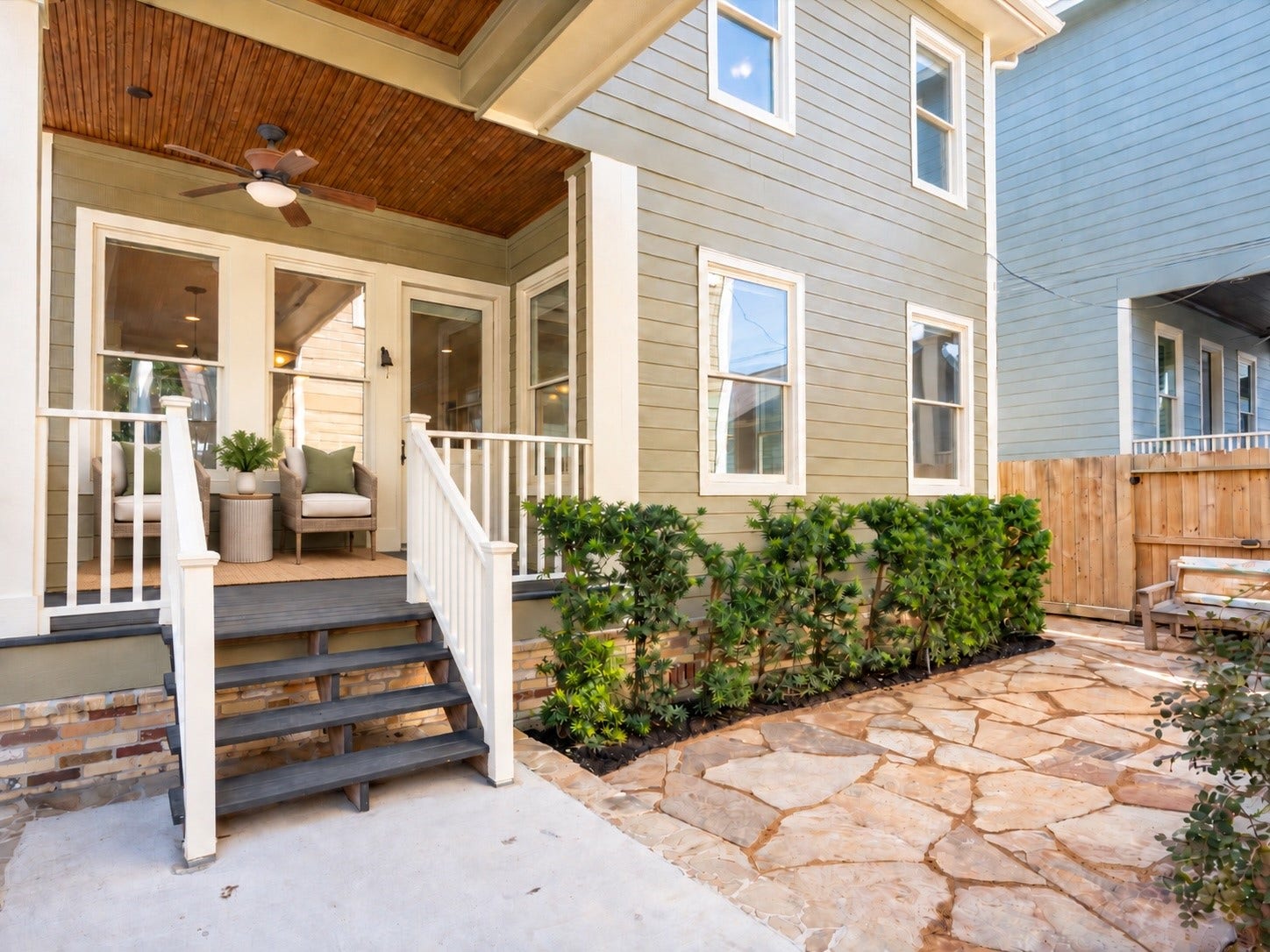 837 E 27th Street, Houston, TX 77009 Experience serene outdoor living on a charming patio with lush greenery and inviting scenery, virtually staged using AI for a perfect blend of style and comfort.