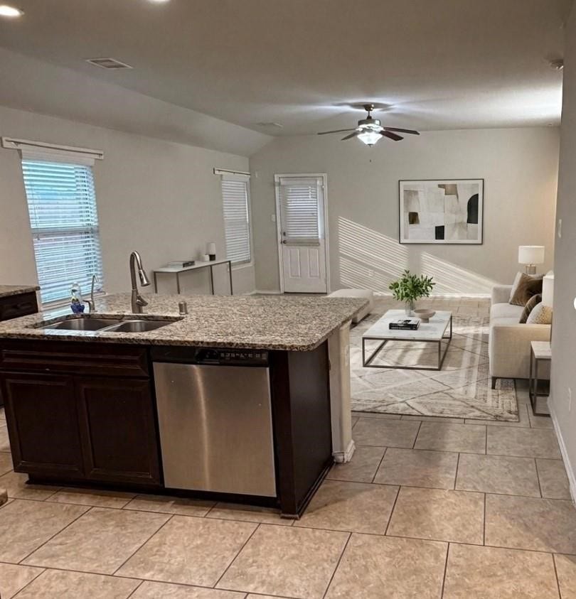 Beautifully staged kitchen and living room showcasing potential for stylish living.