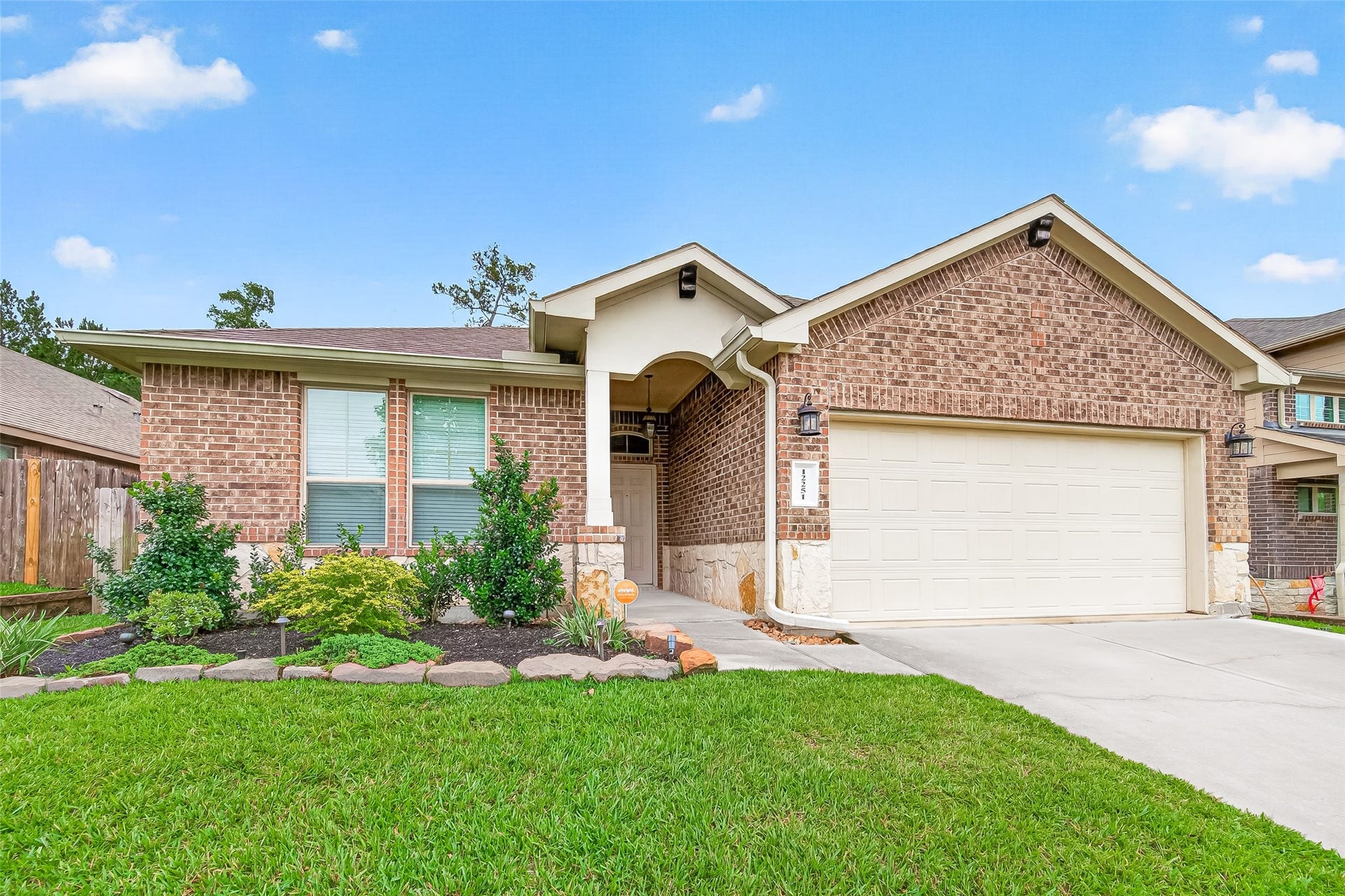 12251 Antilles Lane, Conroe, TX 77304 Charming single-story brick home with a two-car garage and attractive landscaping. Features a clean driveway, well-maintained front yard, and a welcoming entrance. Ideal for comfortable suburban living.