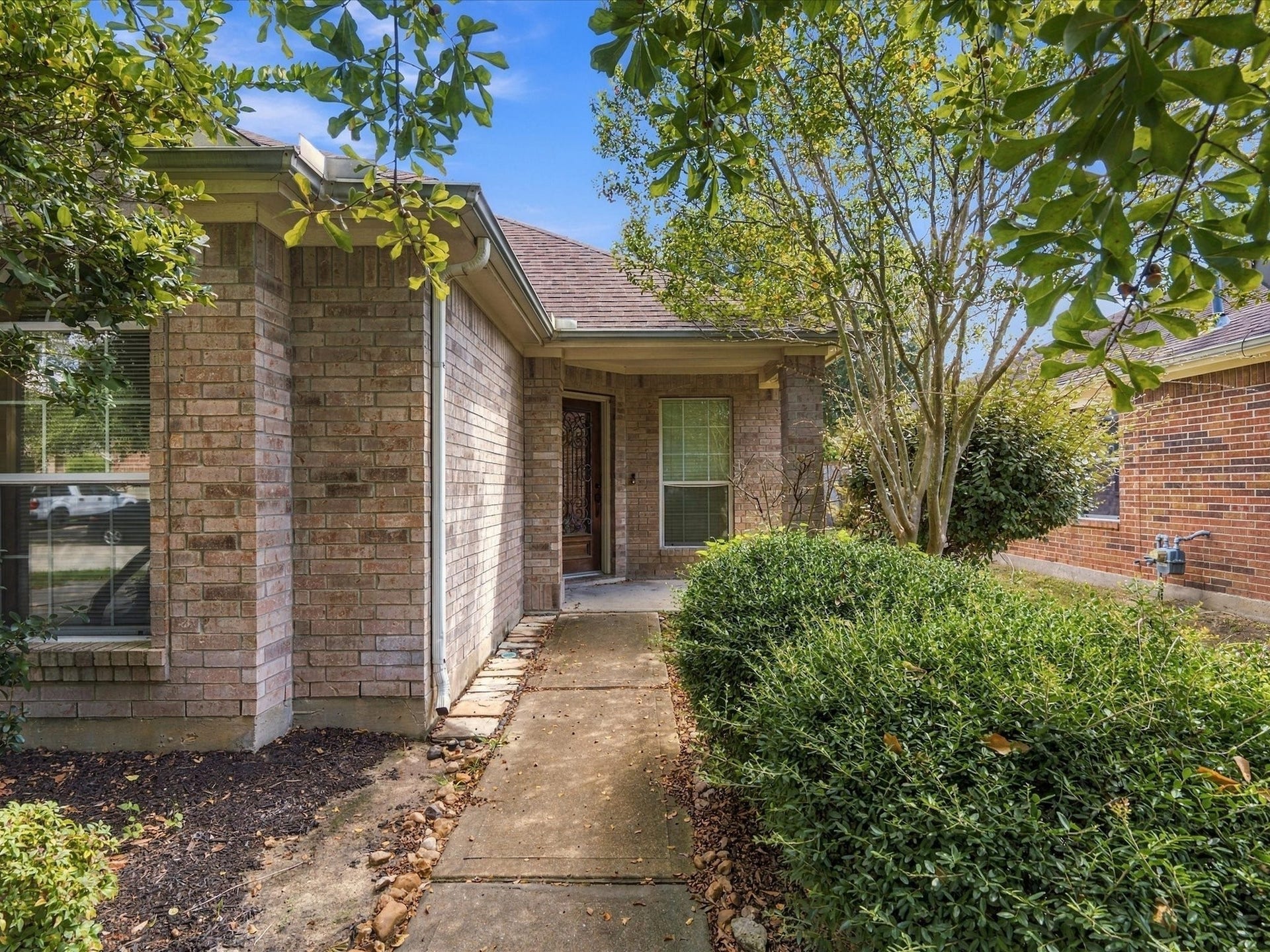 30026 Luna Lakes Drive, Spring, TX 77386 Classic brick detailing and mature landscaping lend timeless character and a well-established feel to the home's exterior.
