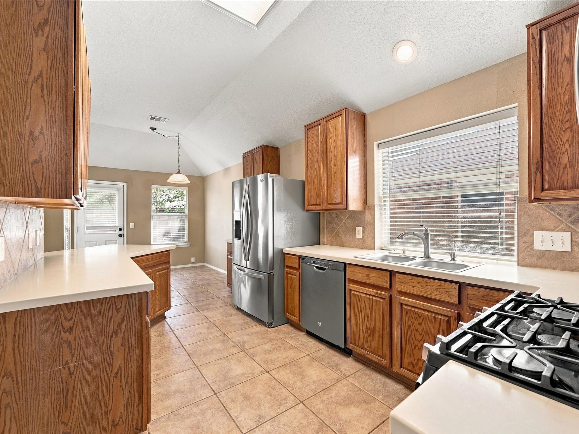 30026 Luna Lakes Drive, Spring, TX 77386 Abundant cabinetry provides generous storage, while natural light brightens the spacious kitchen and creates an inviting place to gather.