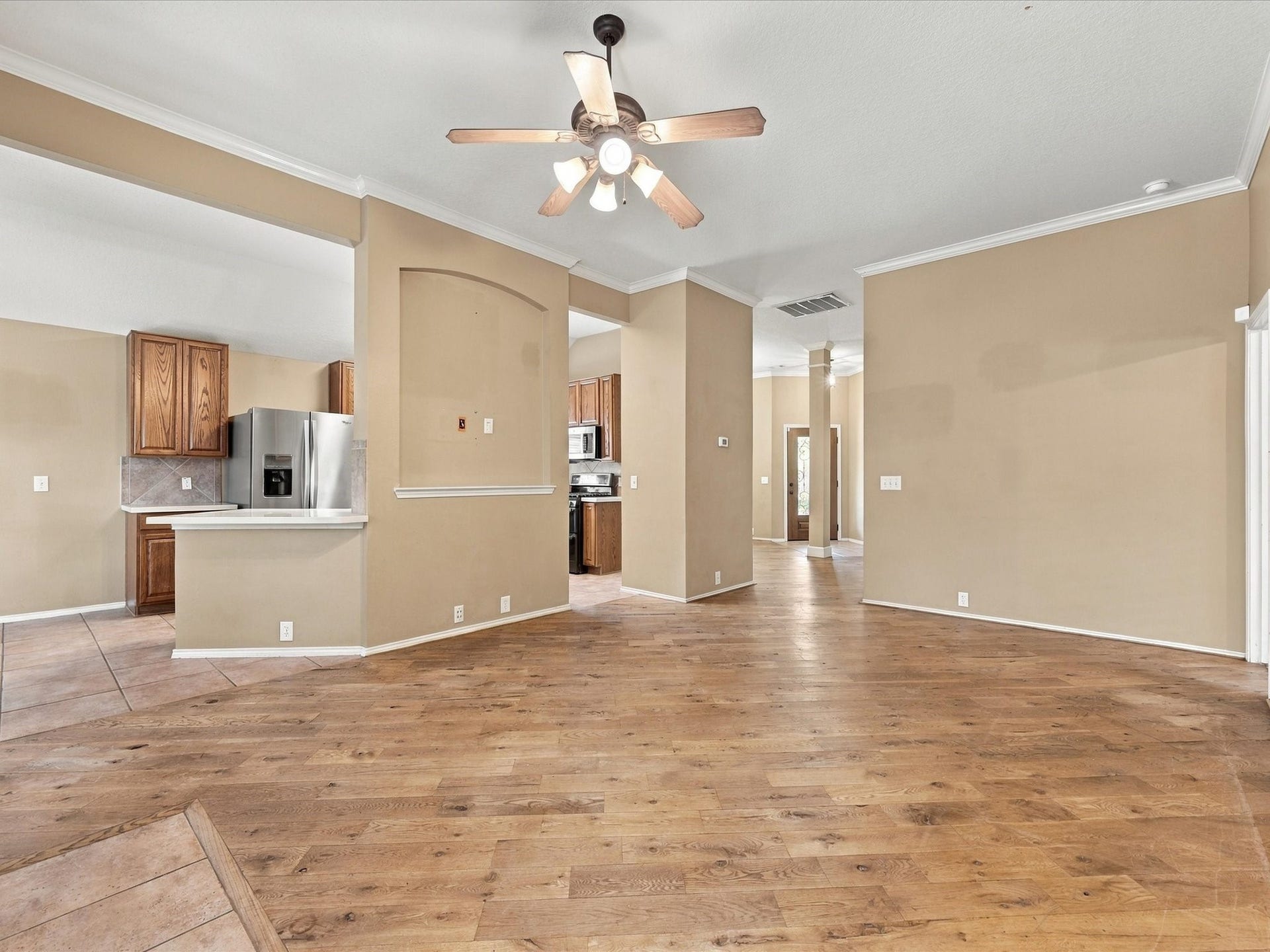 30026 Luna Lakes Drive, Spring, TX 77386 The living room opens seamlessly to the kitchen, creating an easy flow for everyday living, conversation, and entertaining.