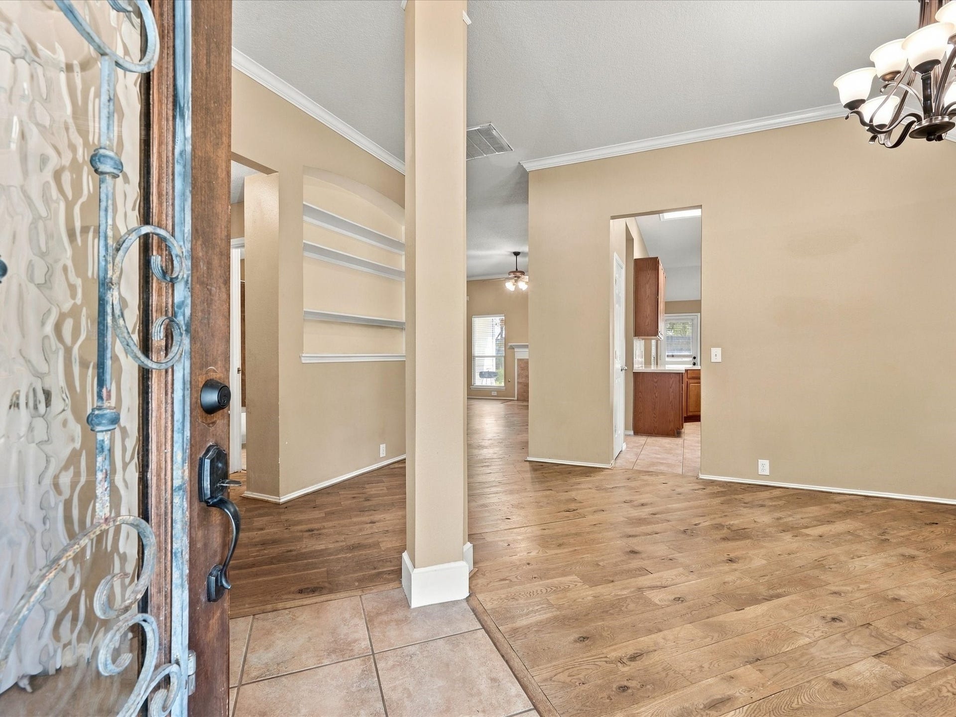 30026 Luna Lakes Drive, Spring, TX 77386 Real maple wood flooring and charming built-ins bring warmth and character to the entry, offering an inviting introduction to the home's interior.