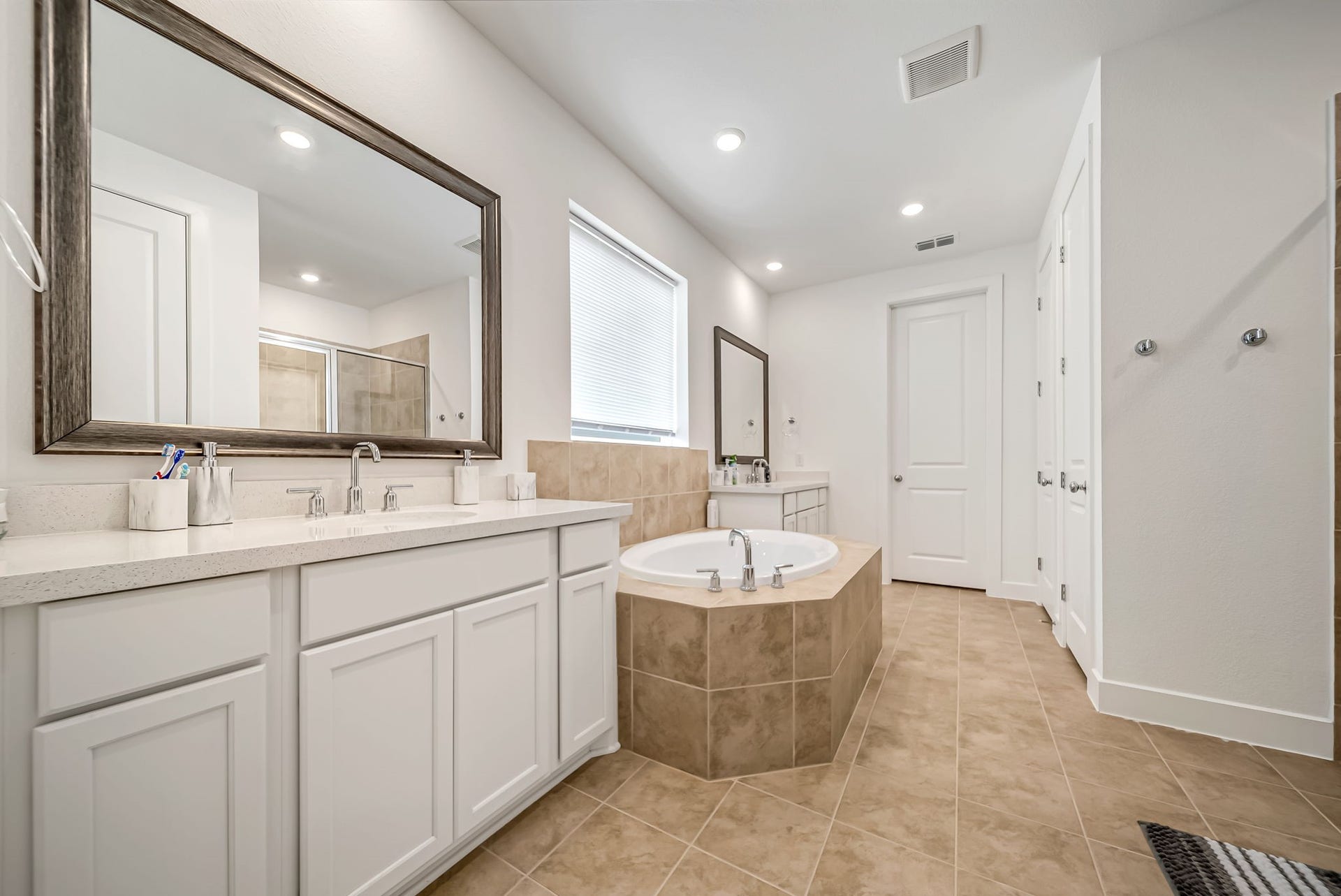 2116 Lila Sky Lane, Friendswood, TX 77546 Spa-Like Primary Double Sink Bath Oasis with Custom Finishes & Soaking Tub. Separate Shower.