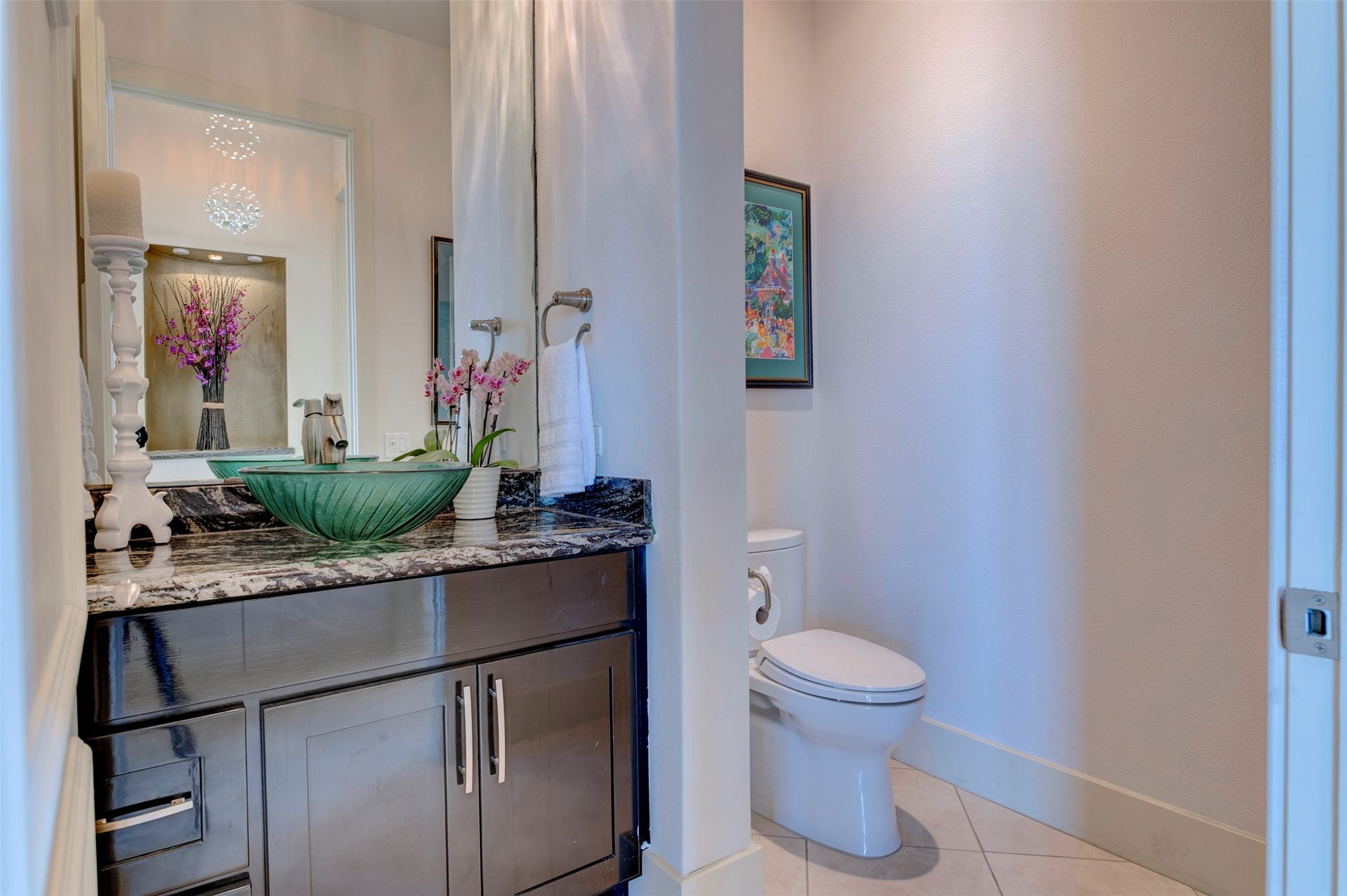 801 E Beach Drive, #BC2808, Galveston, TX 77550 Guest half bath near the entry provides easy access from the main living spaces.