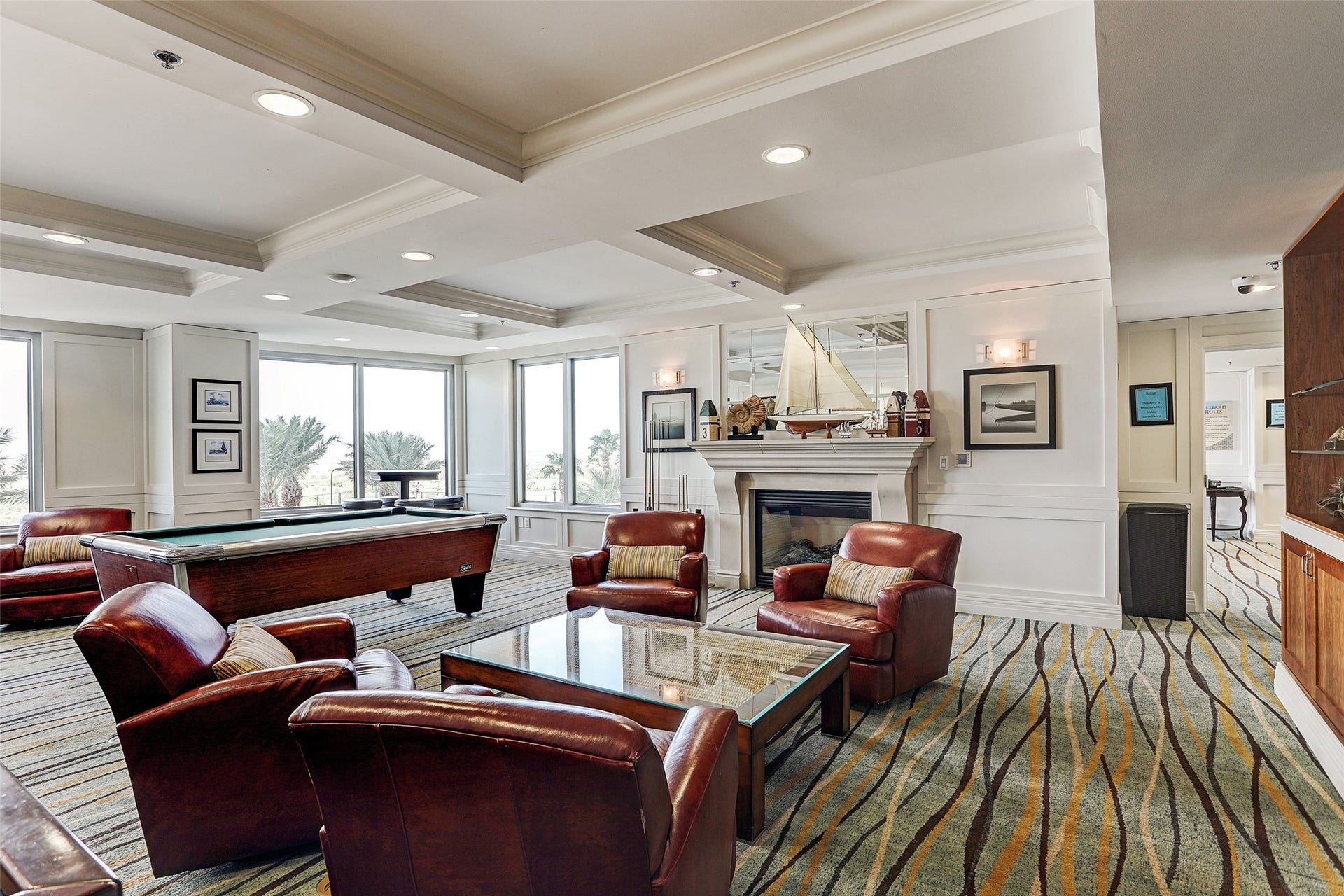 801 E Beach Drive, #BC2808, Galveston, TX 77550 Settle in by the fireplace, enjoy a game of pool, and unwind in a comfortable space designed for relaxed coastal evenings.